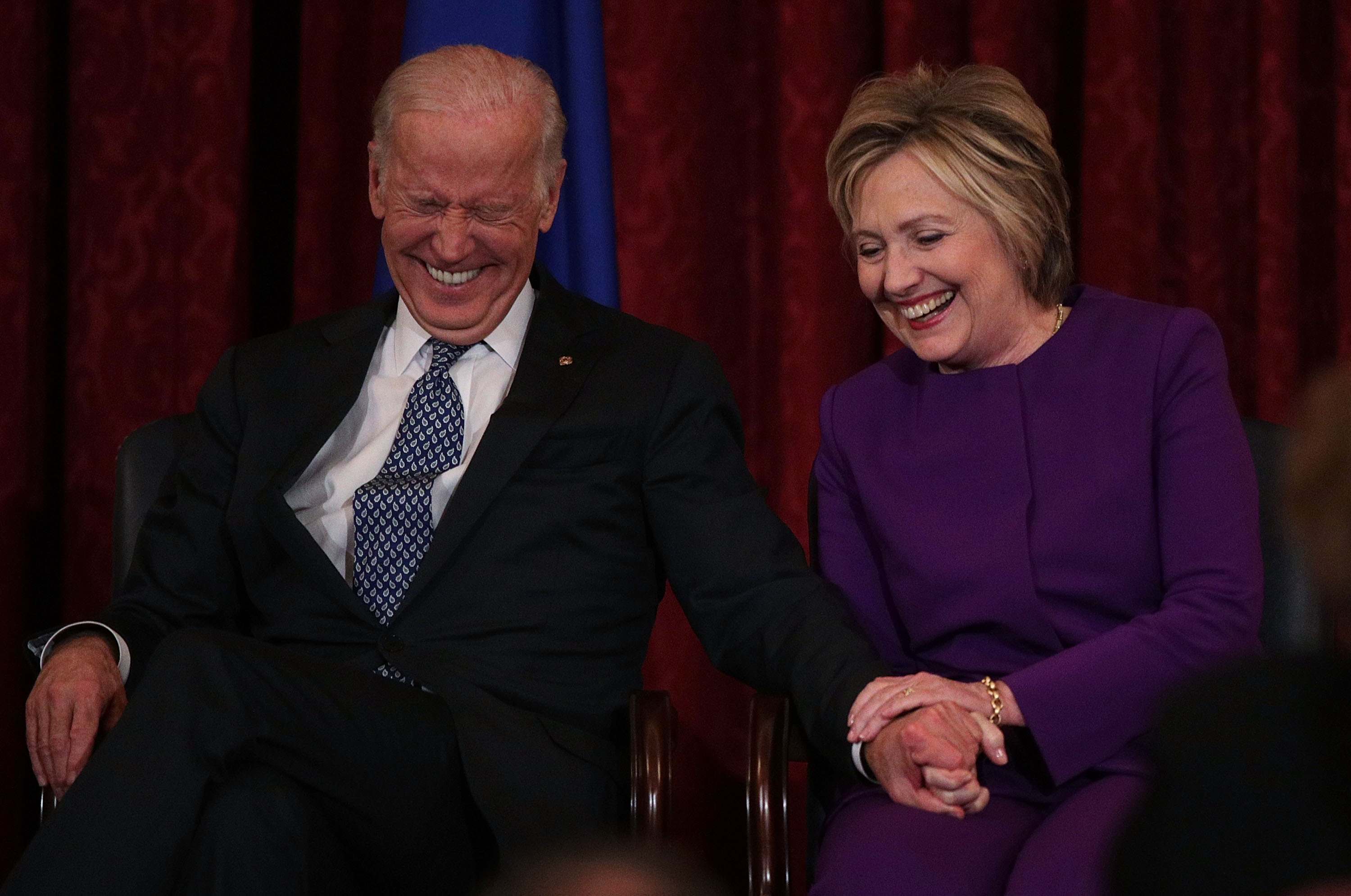 Former U.S. Secretary of State Hillary Clinton (R) shares a moment with Vice President Joseph Biden (L) during a leadership portrait unveiling ceremony for Senate Minority Leader Sen. Harry Reid (D-NV) December 8, 2016 on Capitol Hill in Washington, DC.   (Alex Wong--Getty Images) (Alex Wong&mdash;Getty Images)