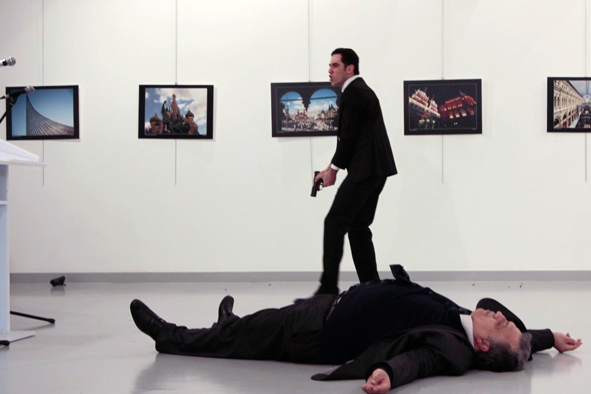 Karlov is seen on the floor after being shot by the gunman at the Ankara gallery on Dec. 19. (Hasim Kilic—AFP/Getty Images)
