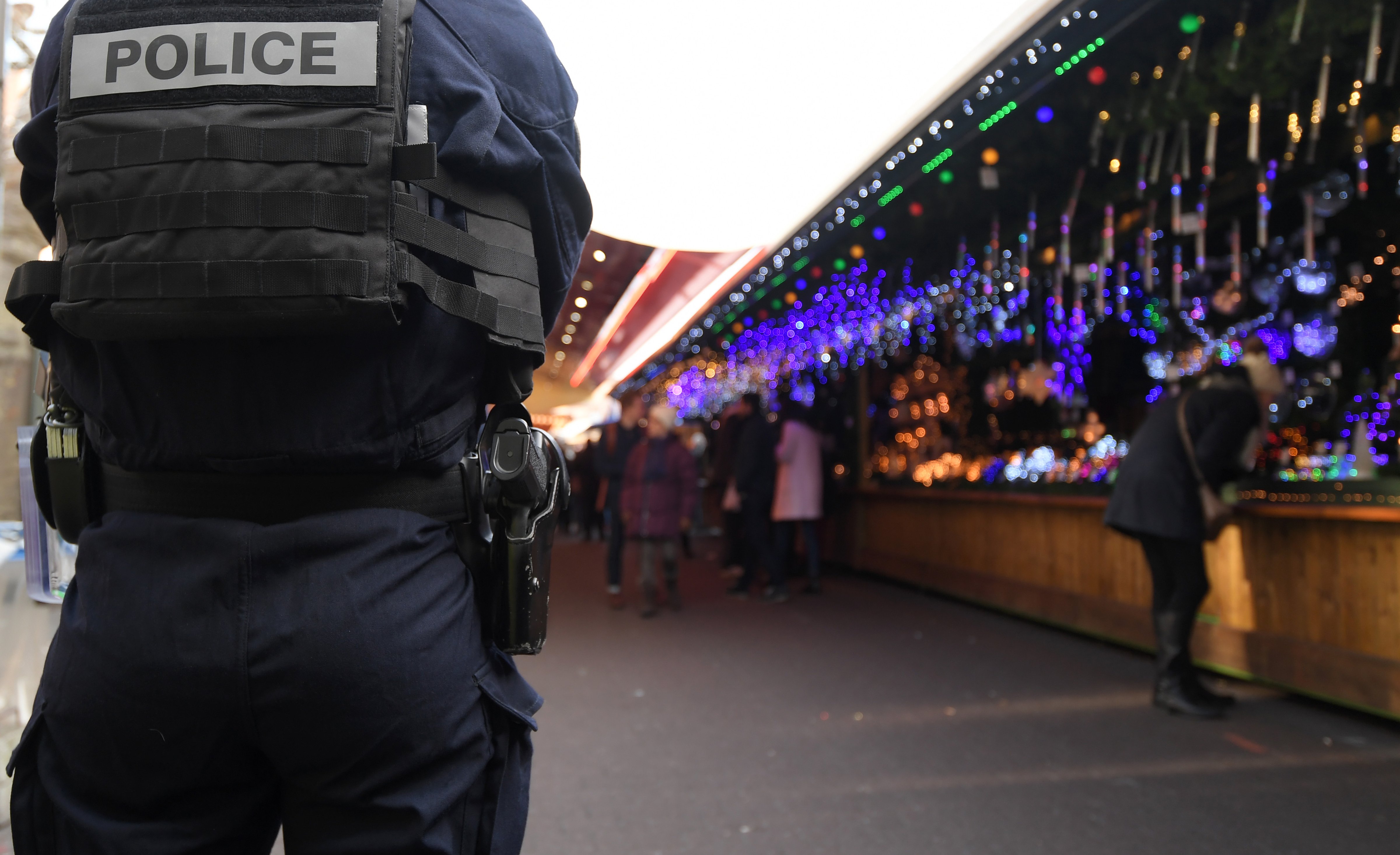 A police officer patrols on the Christmas market in Strasbourg, France, on Dec. 20, 2016. (Patrick Hertzog—AFP/Getty Images)
