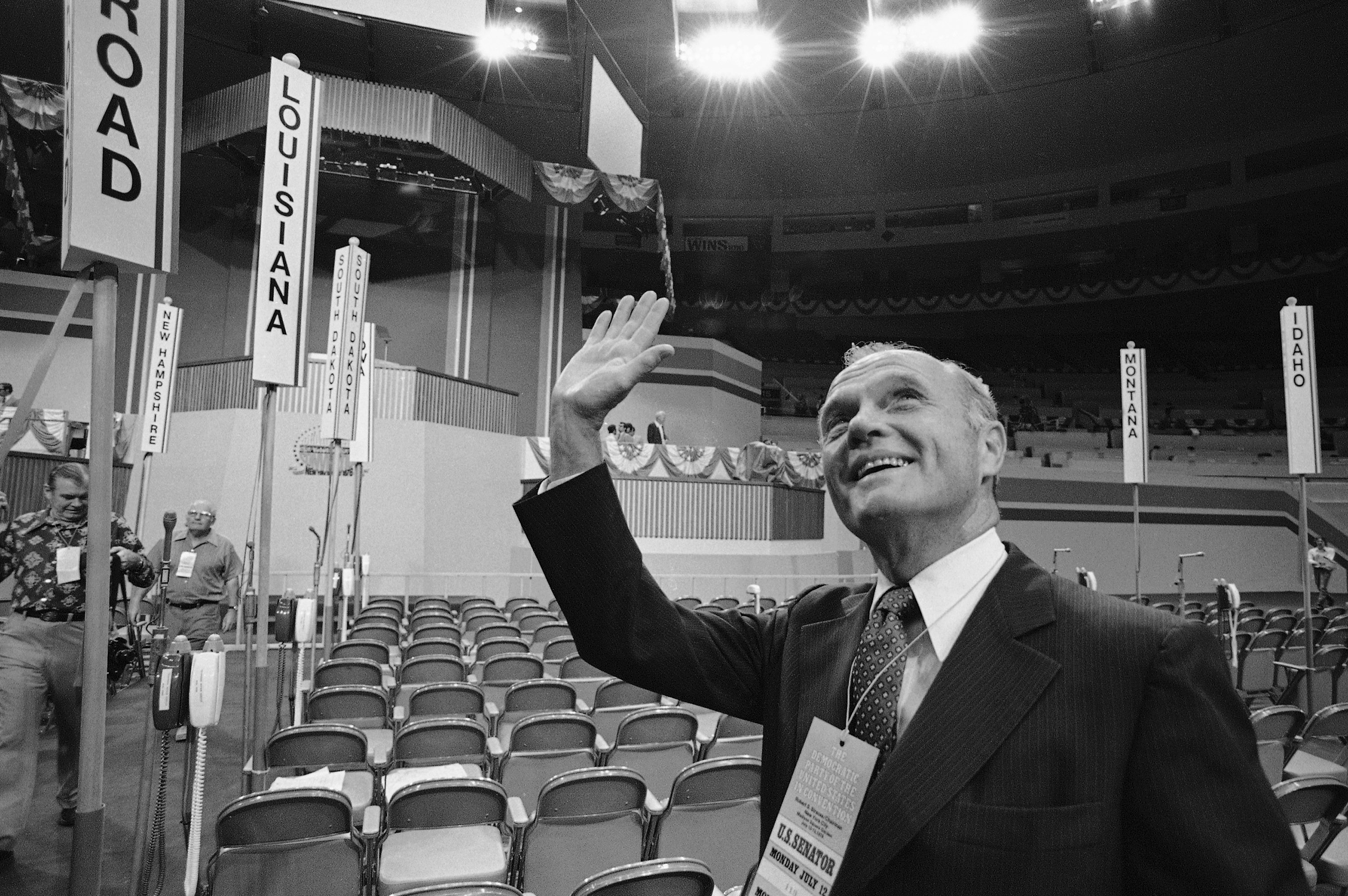 A Political High
                              At a soon-to-be packed Madison Square Garden in New York City in 1976, Glenn waves to a supporter before his keynote address to the Democratic convention.