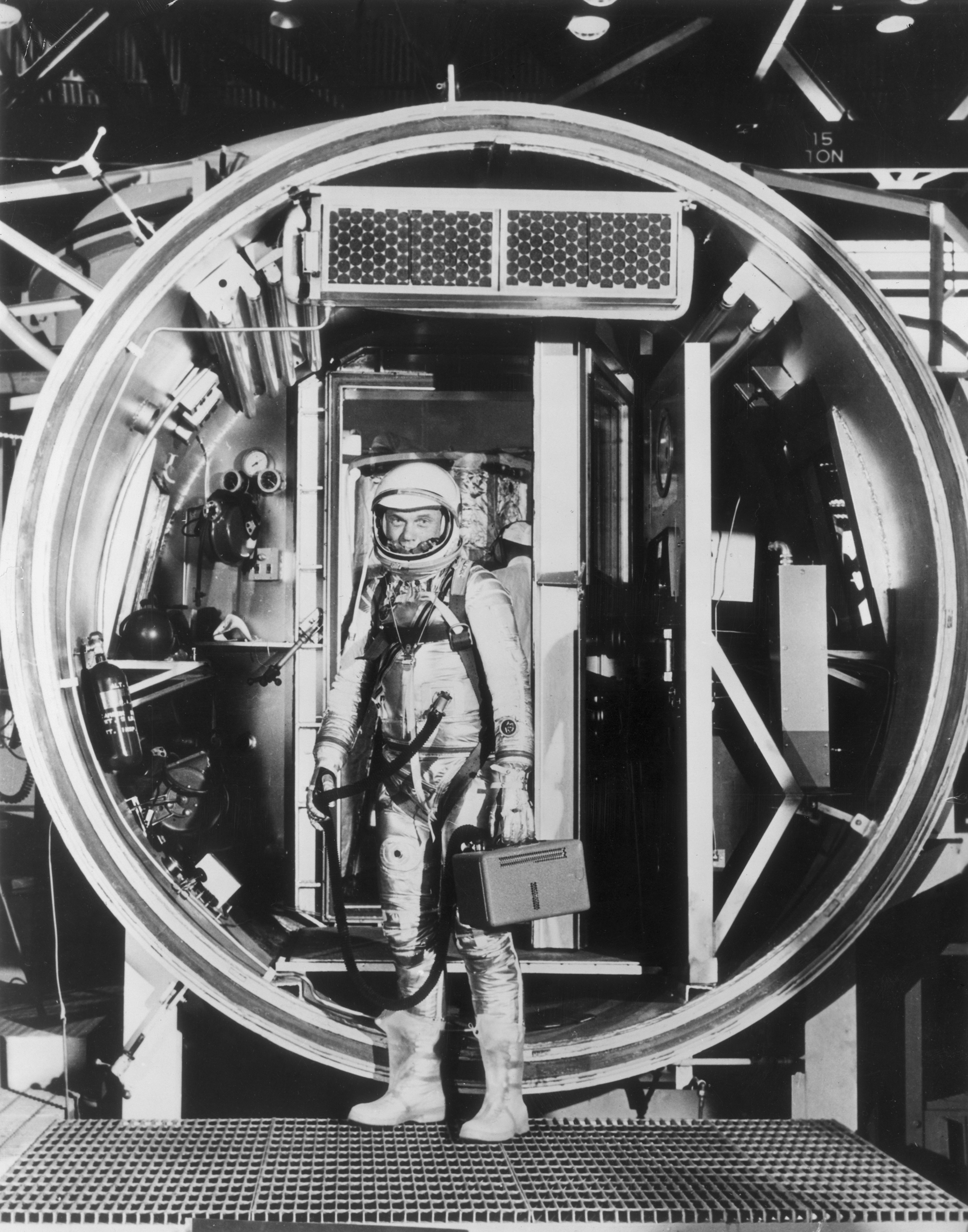 High-Tech Testing Glenn, in 1962, in a fully pressurized suit, prepares to enter an altitude chamber, which simulates air pressure at various stages of flight.