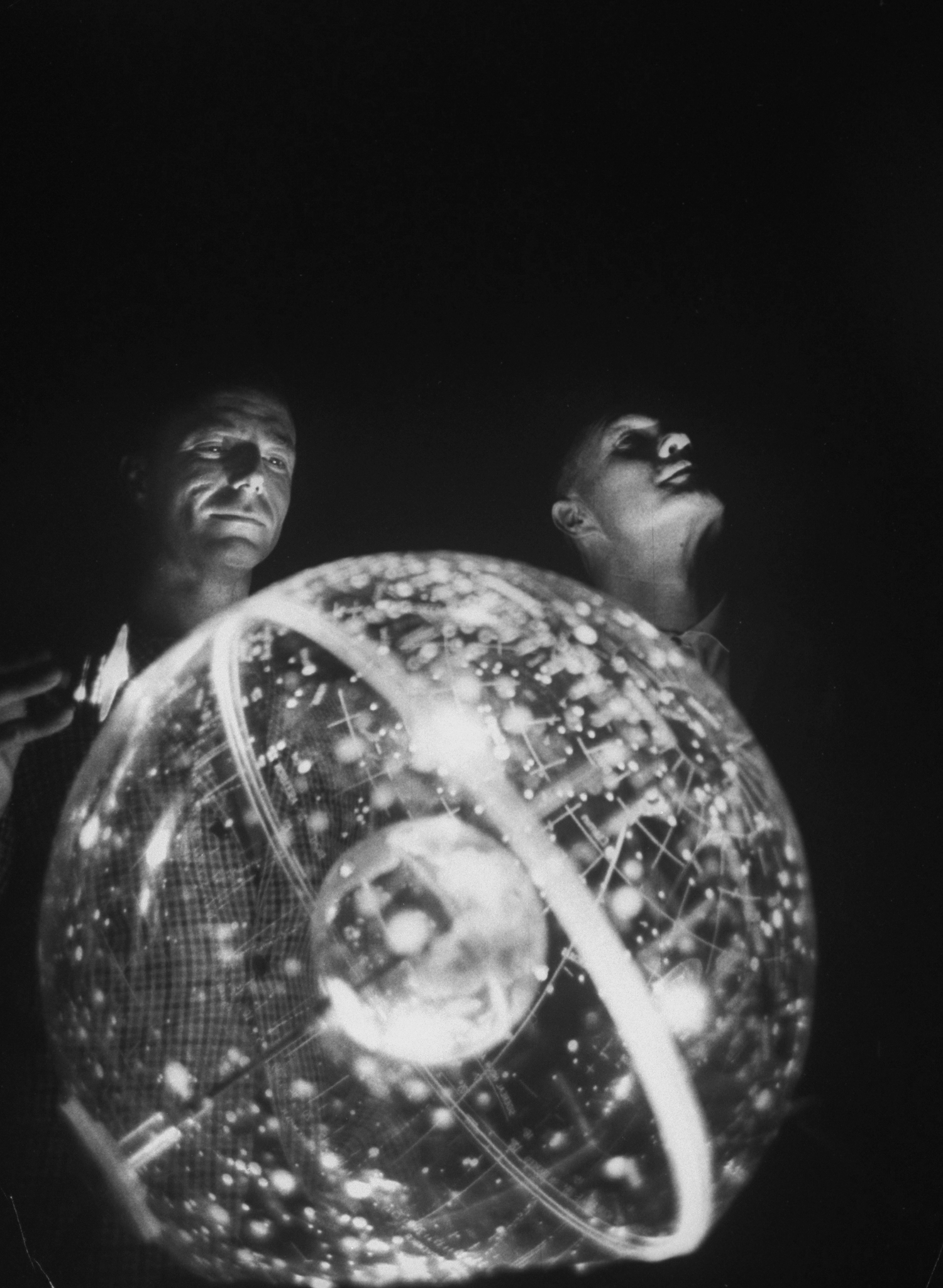 Celestial Ambitions Scott Carpenter, left, and Glenn study the three-dimensional celestial trainer in 1961.