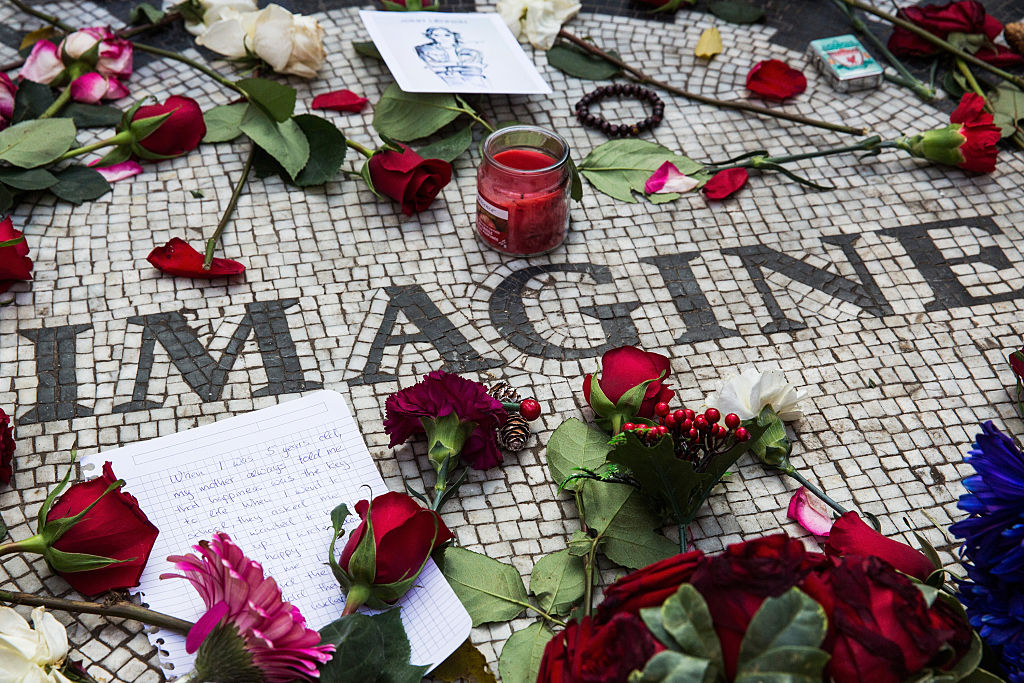 Memorabilia sits a top the "Strawberry Fields" tile mosaic in Central Park, which was created in tribute to the late musician John Lennon, to mark the 35-year anniversary of his death on December 8, 2015 in New York City. (Andrew Burton—Getty Images)