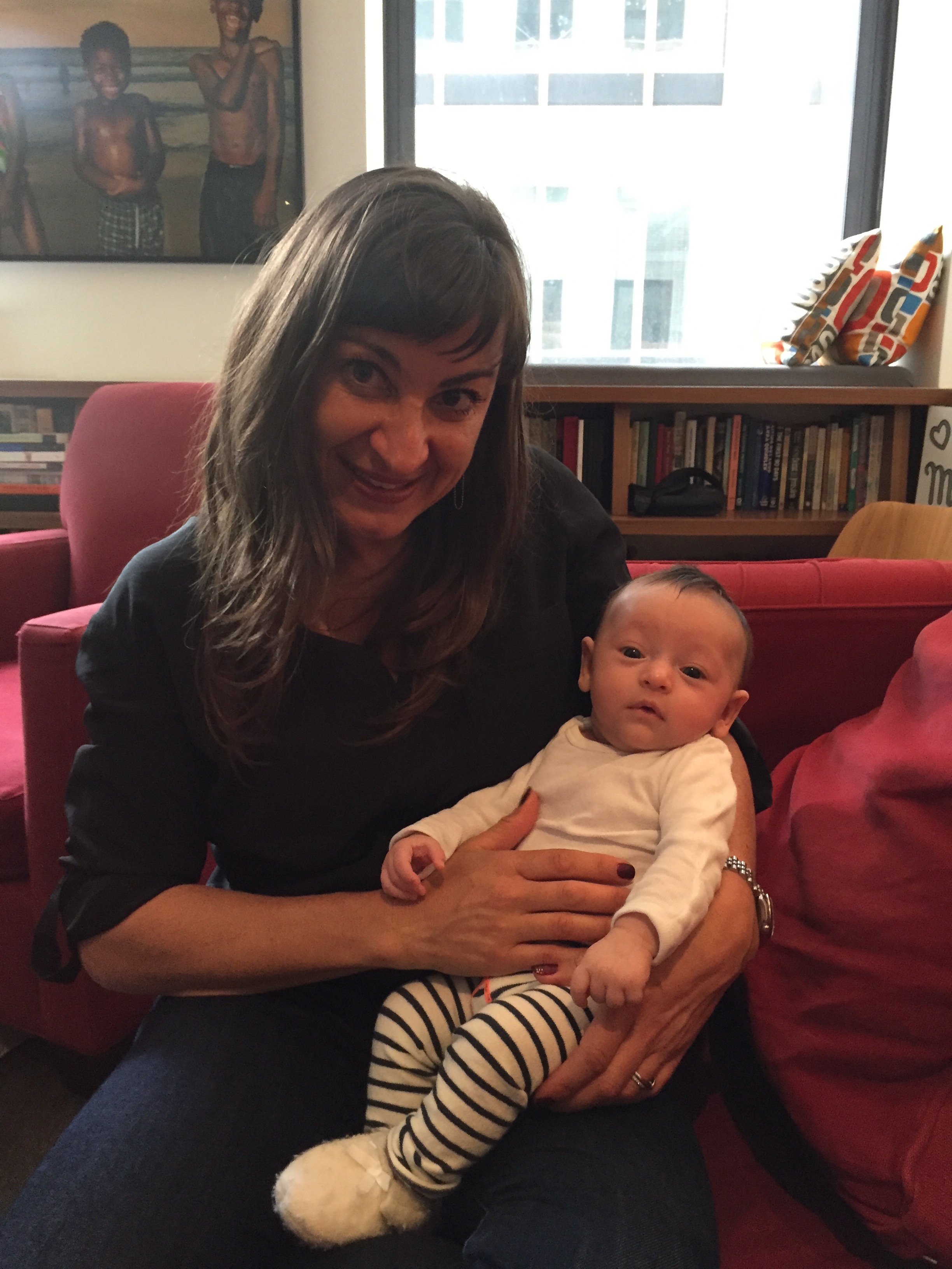 Lynsey Addario, pictured here, holding Pollack's baby girl in April 2016.