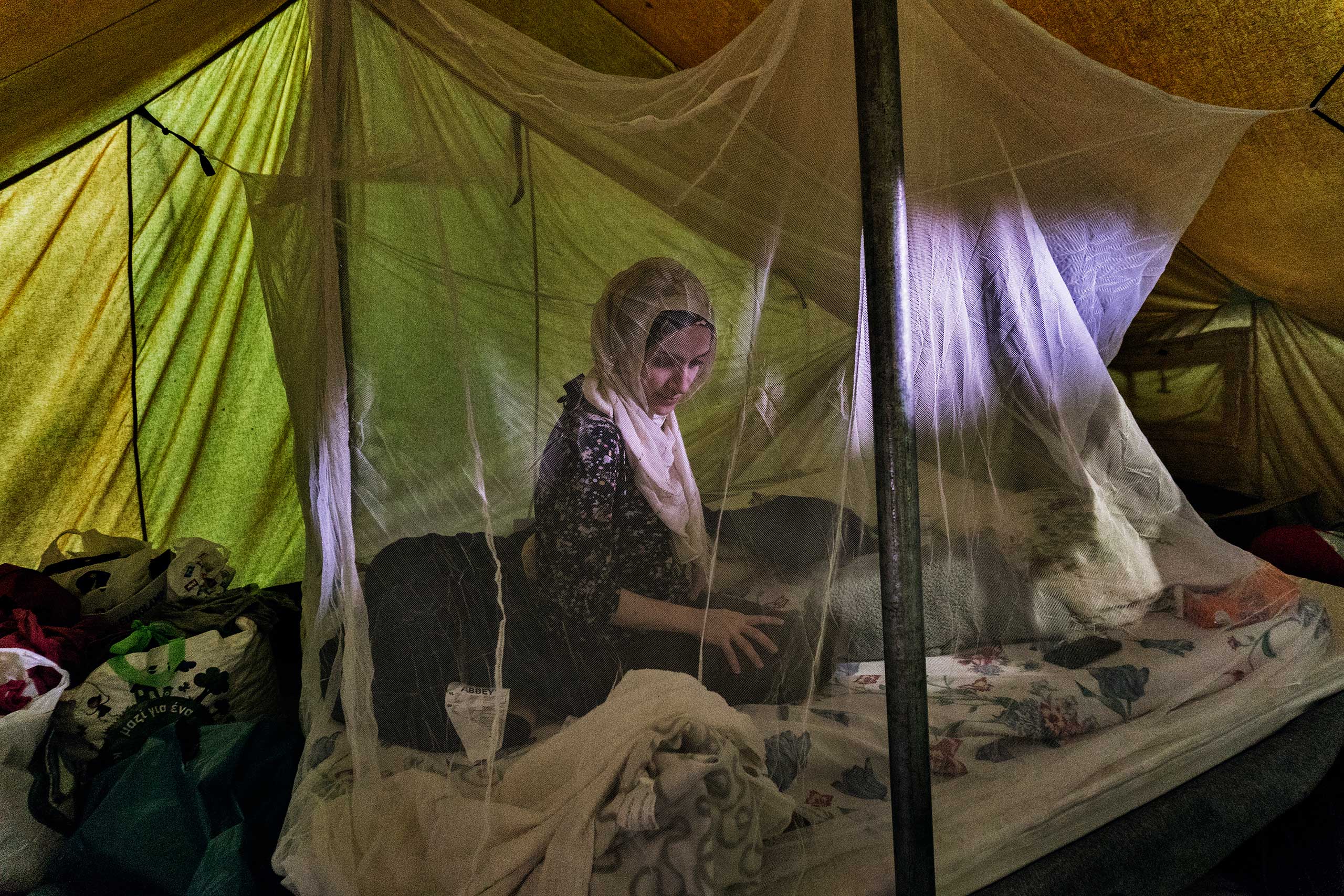 Taimaa Abazli, 24, sits in her tent at a refugee camp in Thessaloniki, Greece, Sept. 26, 2016.