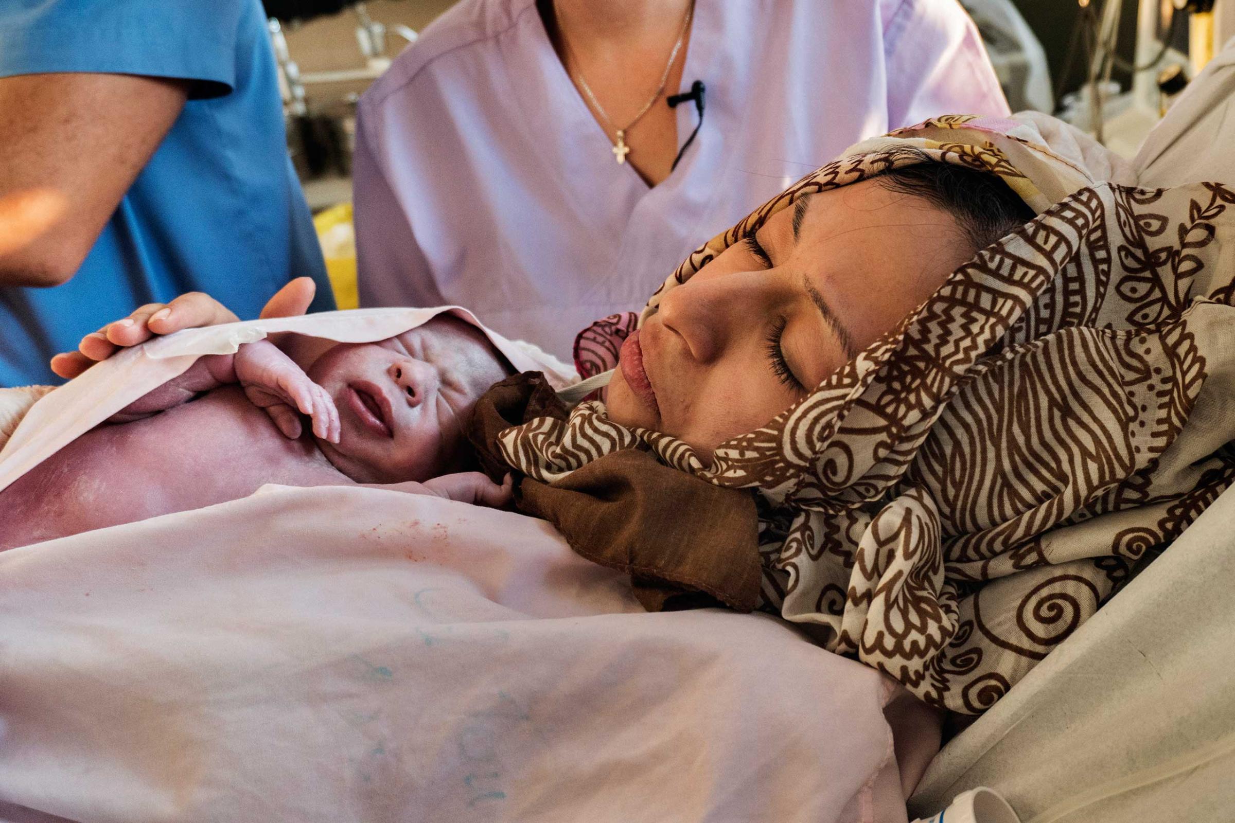 Sanaa Mattar Razzouk, 23, from Deir ez-Zor, Syria, gave birth to her second child on Sept. 27, 2016, Her husband, Hamza Adnan Khzam, 25, said: “My first child was born as a refugee in Turkey,” ...this one in Greece. They are children of no country.” Pointing to the sky, he added, “they are God’s children now, and God will take care of them.”