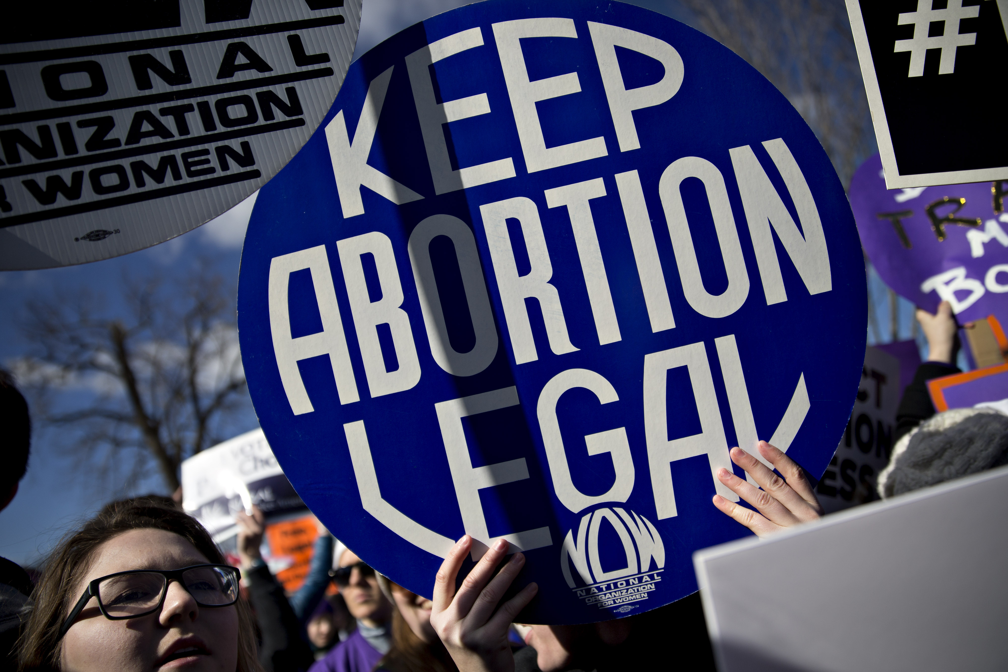 A demonstrator holds up a sign in support of pro-life rights outside the U.S. Supreme Court in Washington, D.C., U.S., on Wednesday, March 2, 2016. (Bloomberg/Getty Images)