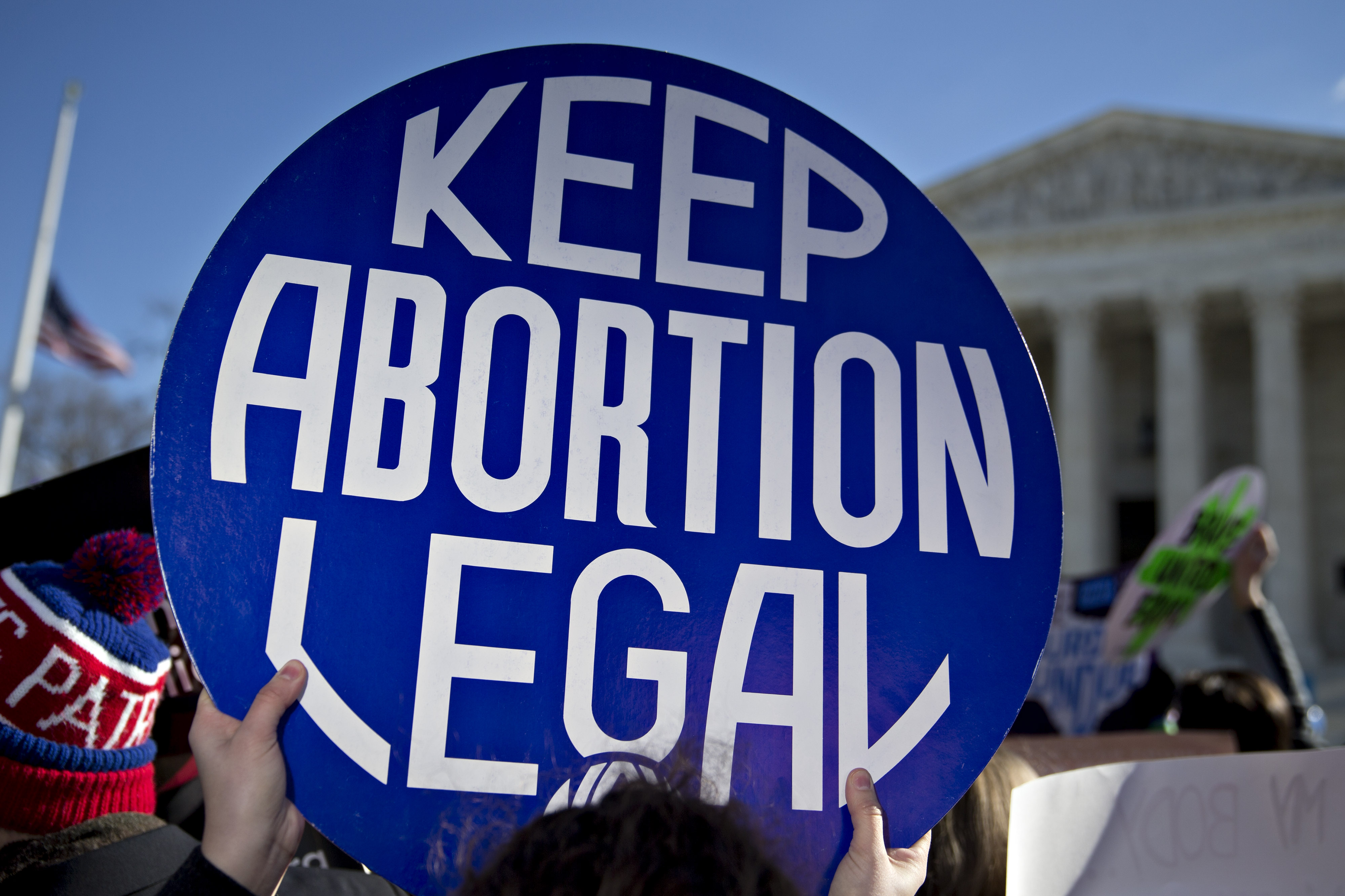 A demonstrator holds up a sign in support of abortion rights outside the U.S. Supreme Court in Washington, D.C., U.S., on Wednesday, March 2, 2016. Supreme Court justices clashed in their first abortion showdown in almost a decade as a pivotal justice suggested the court could stop short of a definitive ruling on a disputed Texas law regulating clinics. Photographer: Andrew Harrer/Bloomberg via Getty Images (Bloomberg—Bloomberg via Getty Images)