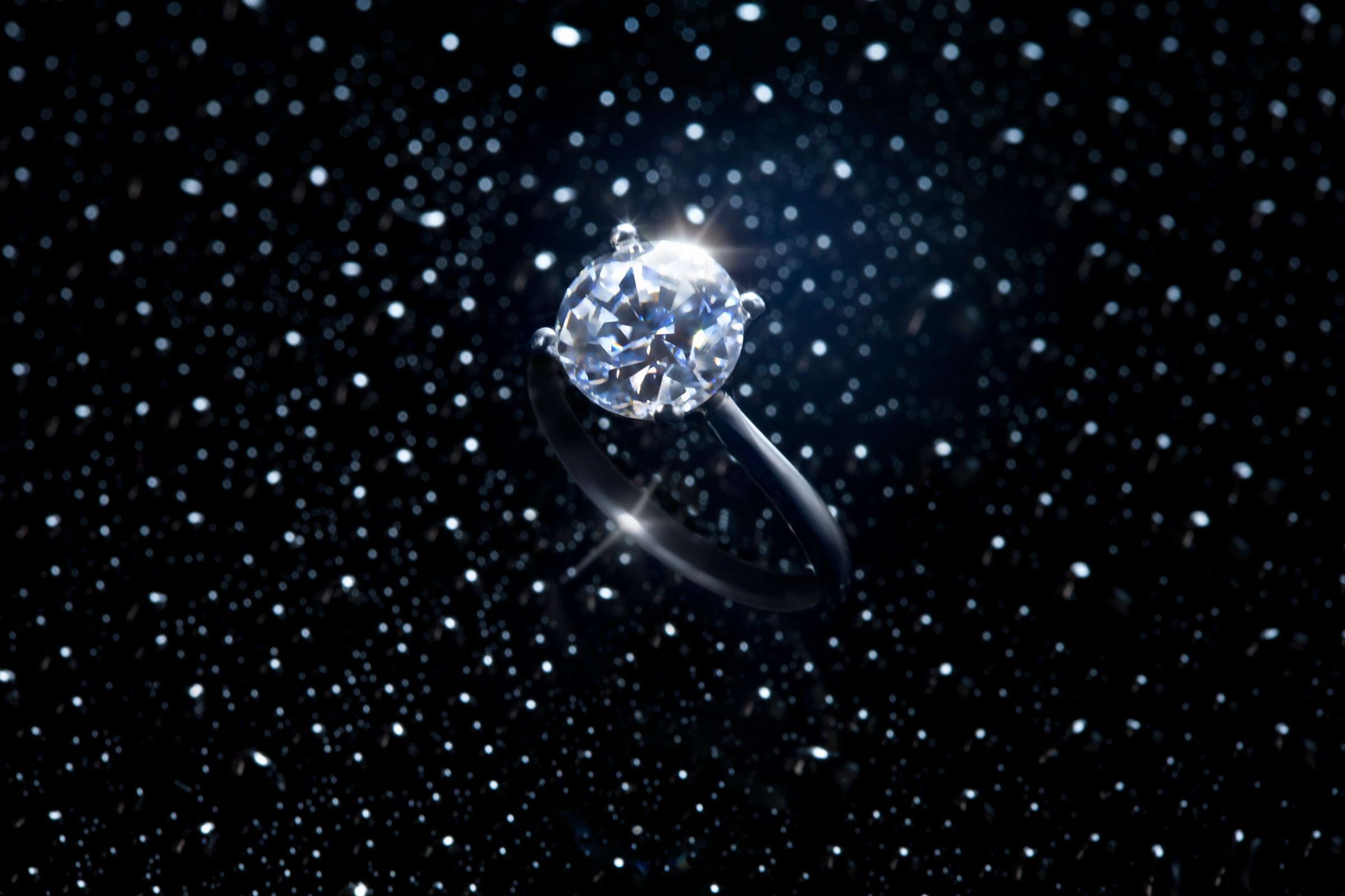 Diamond ring against starry sky