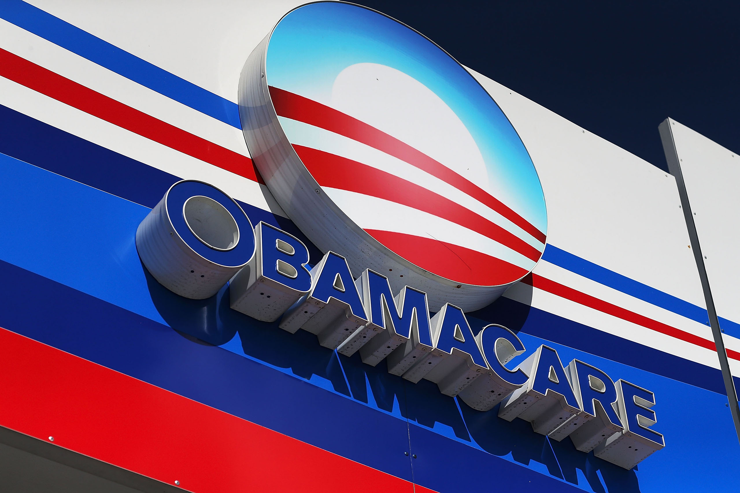 An Obamacare sign is seen on the UniVista Insurance company office on Dec. 15, 2015 in Miami, Florida. (Joe Raedle—Getty Images)