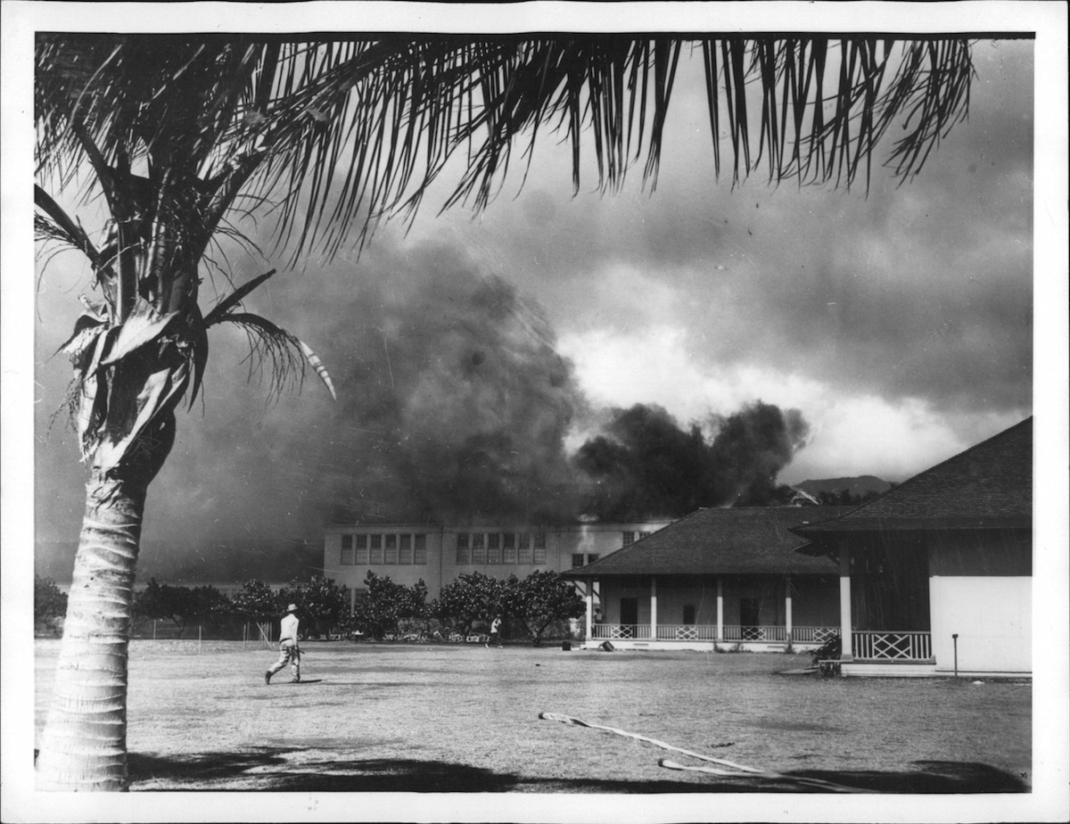 Honolulu school goes up in flames after the surprise bombing by the Japanese (Iconic Archive / Getty Images)