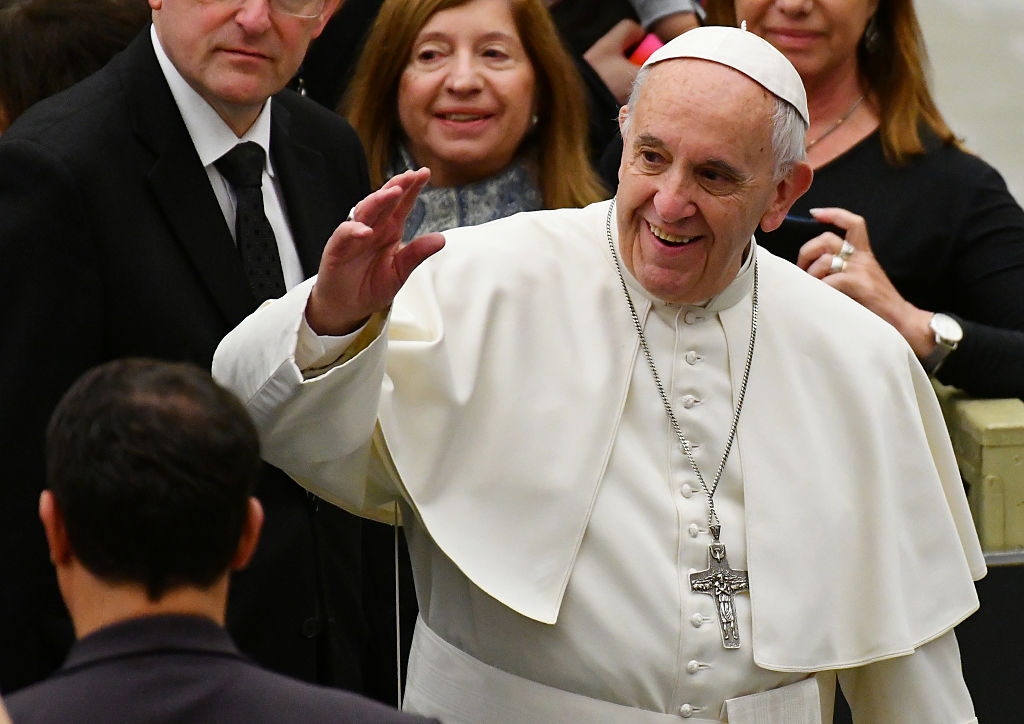 Pope Francis greets the crowd during his weekly general audience at the Paul VI audience Hall on December 7, 2016 in Vatican. (VINCENZO PINTO—AFP/Getty Images)
