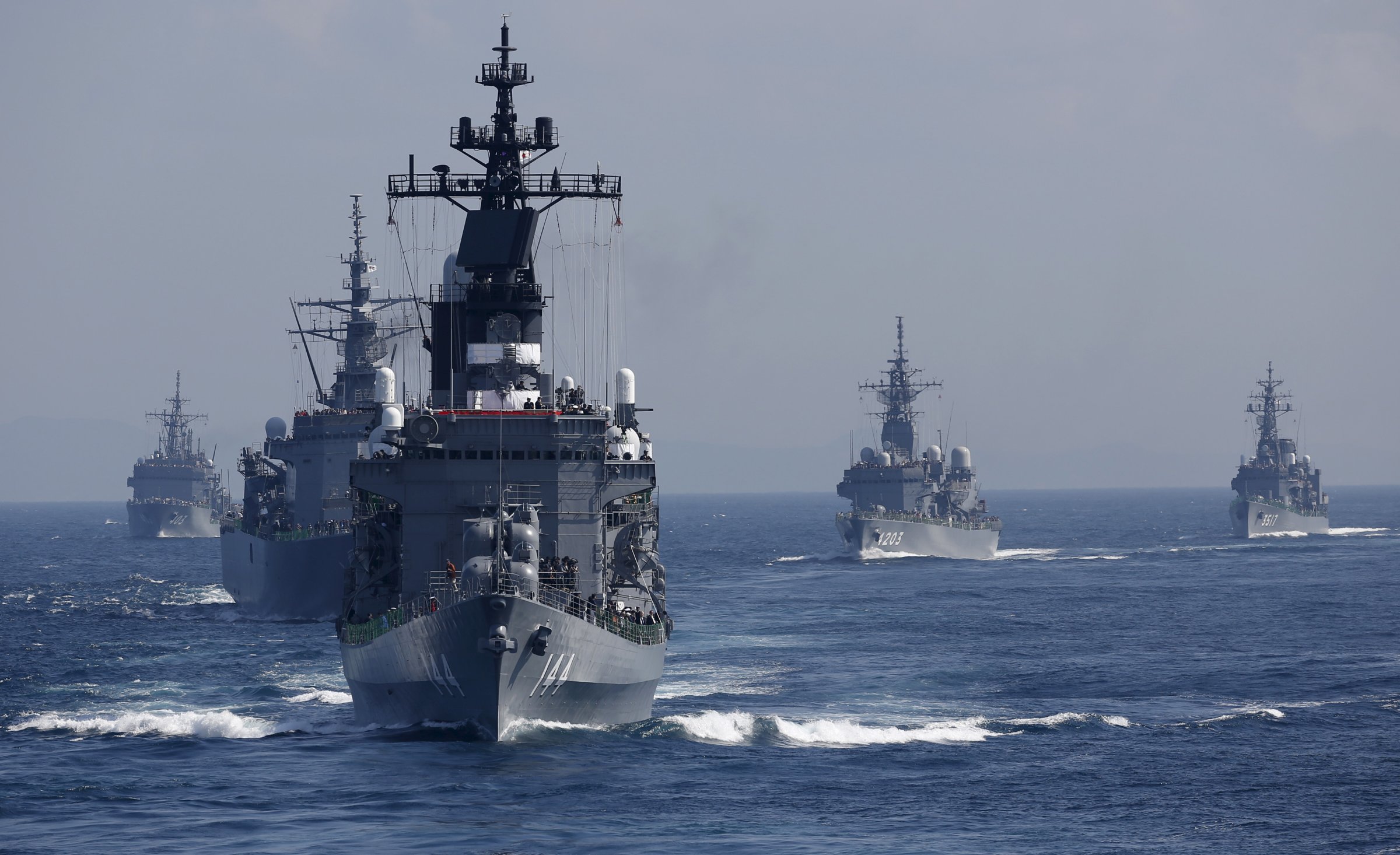 JMSDF destroyer Kurama, which is carrying Japan's PM Abe,  leads the MSDF fleet during its fleet review at Sagami Bay, off Yokosuka