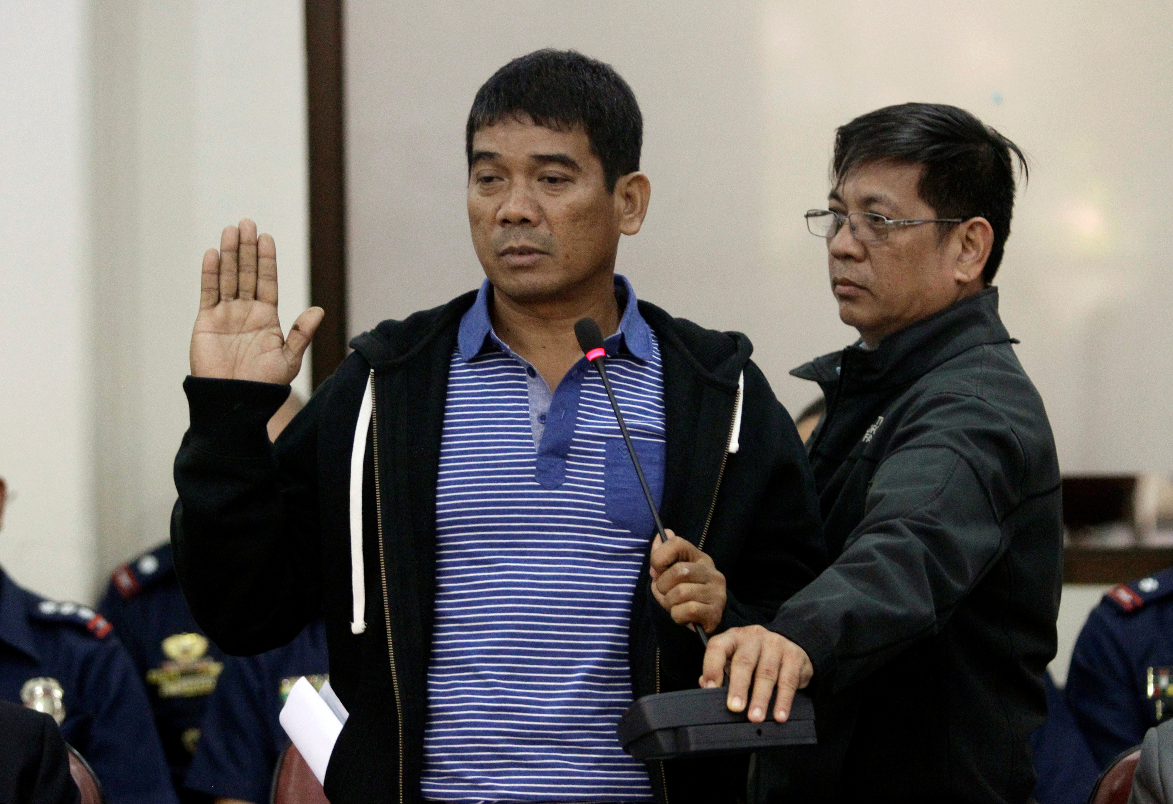 Ronnie Dayan, former aide and former lover of Senator Leila de Lima, takes an oath during a congressional committee hearing on the drug trade, inside the National Penitentiary, at the House of the Representatives in Manila on Nov. 24, 2016 (Czar Dance—Reuters)