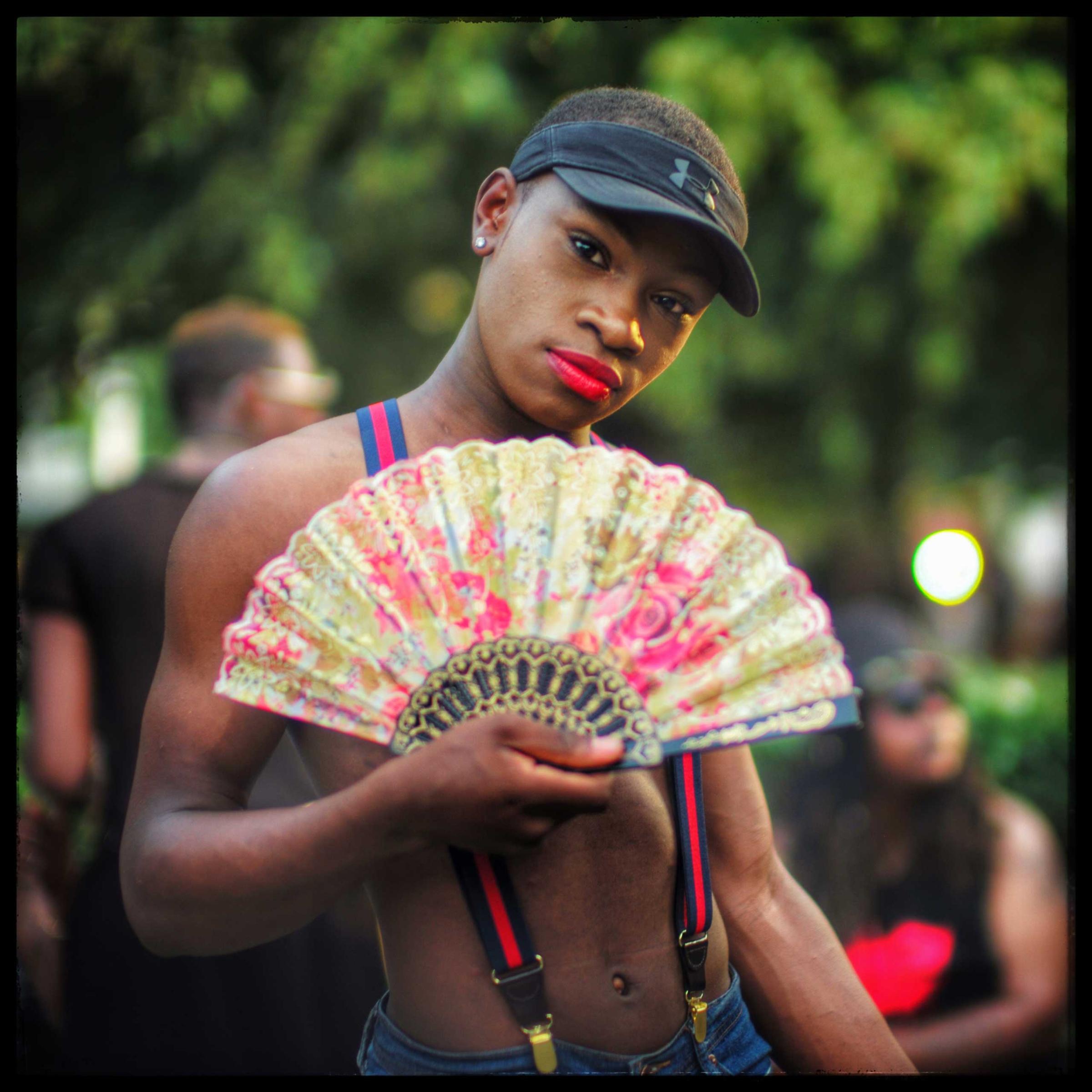 A D.C. Pride goer poses for a photograph before inviting me to come to Miami to photograph Miami Pride. Days later, a lone gunman opened fire inside The Pulse gay club in Orlando.