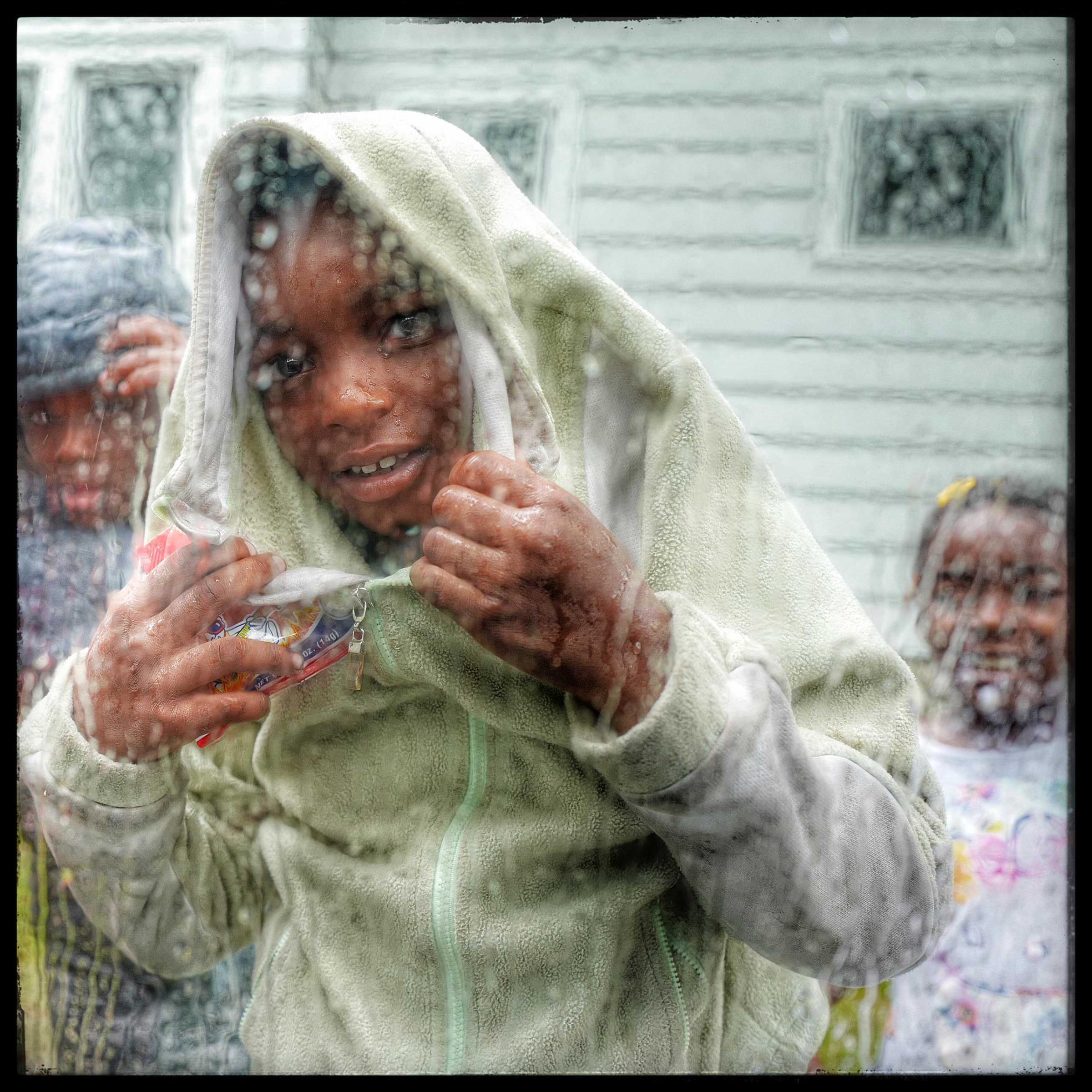 Children in Milwaukee, Winsconsin runs up to the car window to inquire if there was anything to eat.
