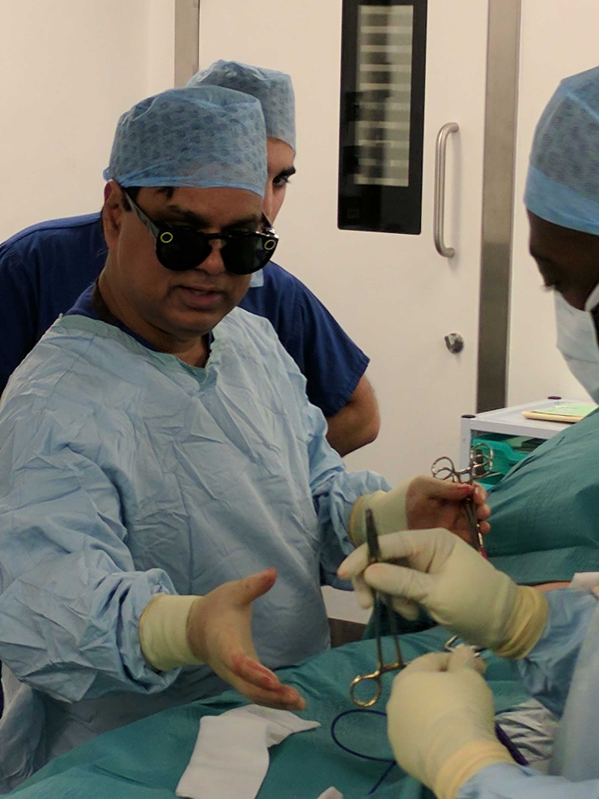 Dr. Shafi Ahmed perfoms surgery with the Snapchat Spectacles, Dec. 9, 2016. (Chris Rogers)