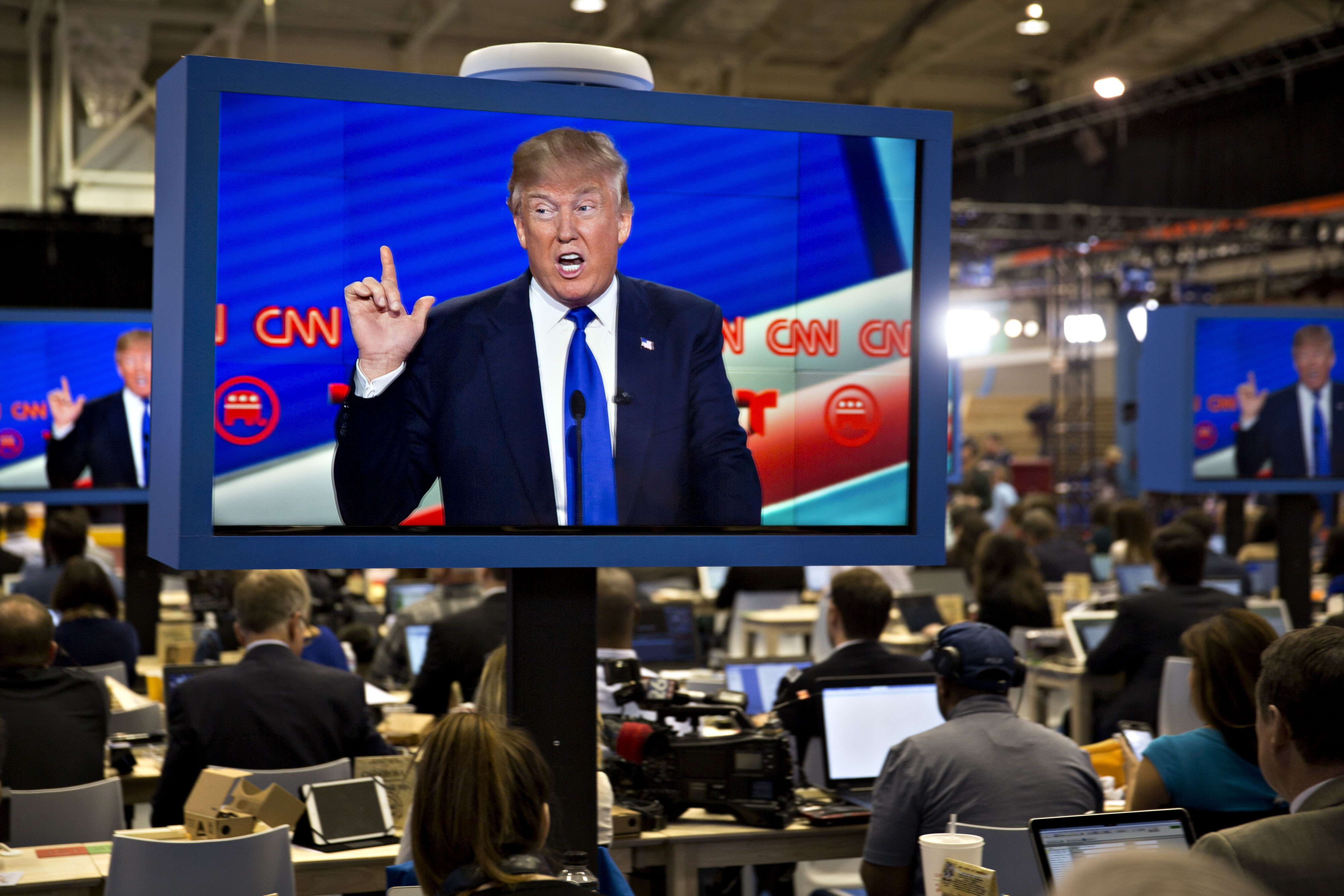 Donald Trump is seen speaking on a television screen in the filing center during the Republican presidential primary candidate debate sponsored by CNN and Telemundo at the University of Houston in Houston on  Feb. 25, 2016. (Bloomberg via Getty Images)