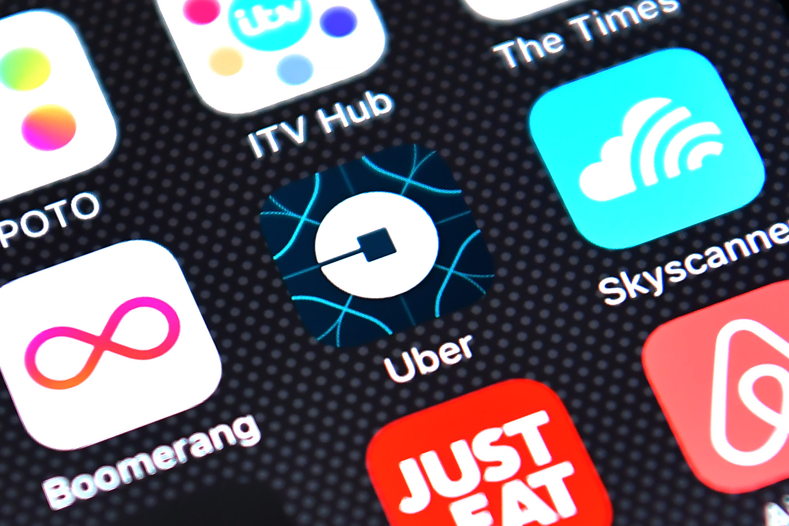 The Uber app logo is displayed on an iPhone on August 3, 2016 in London, England. (Carl Court—Getty Images)