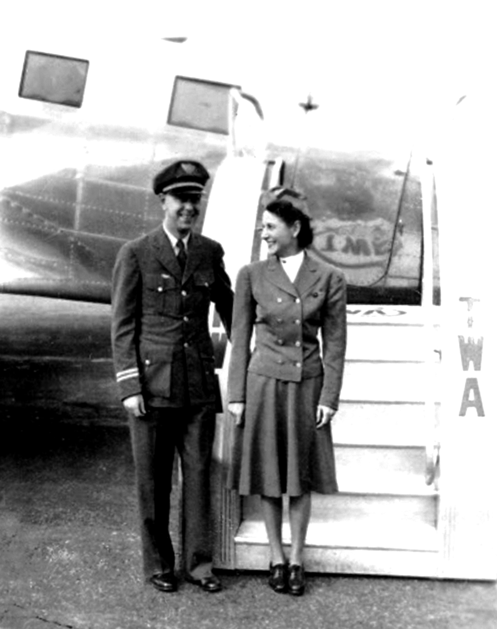 TWA air hostess Alice Getz poses with veteran Capt. Wayne Williams beside a DC-3. Both would be killed in the crash of TWA Flight 3.