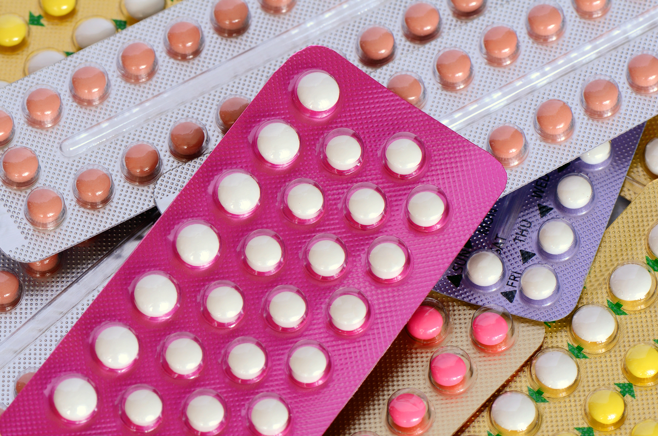Colorful oral contraceptive pill both 21 and 28 tablets strips.