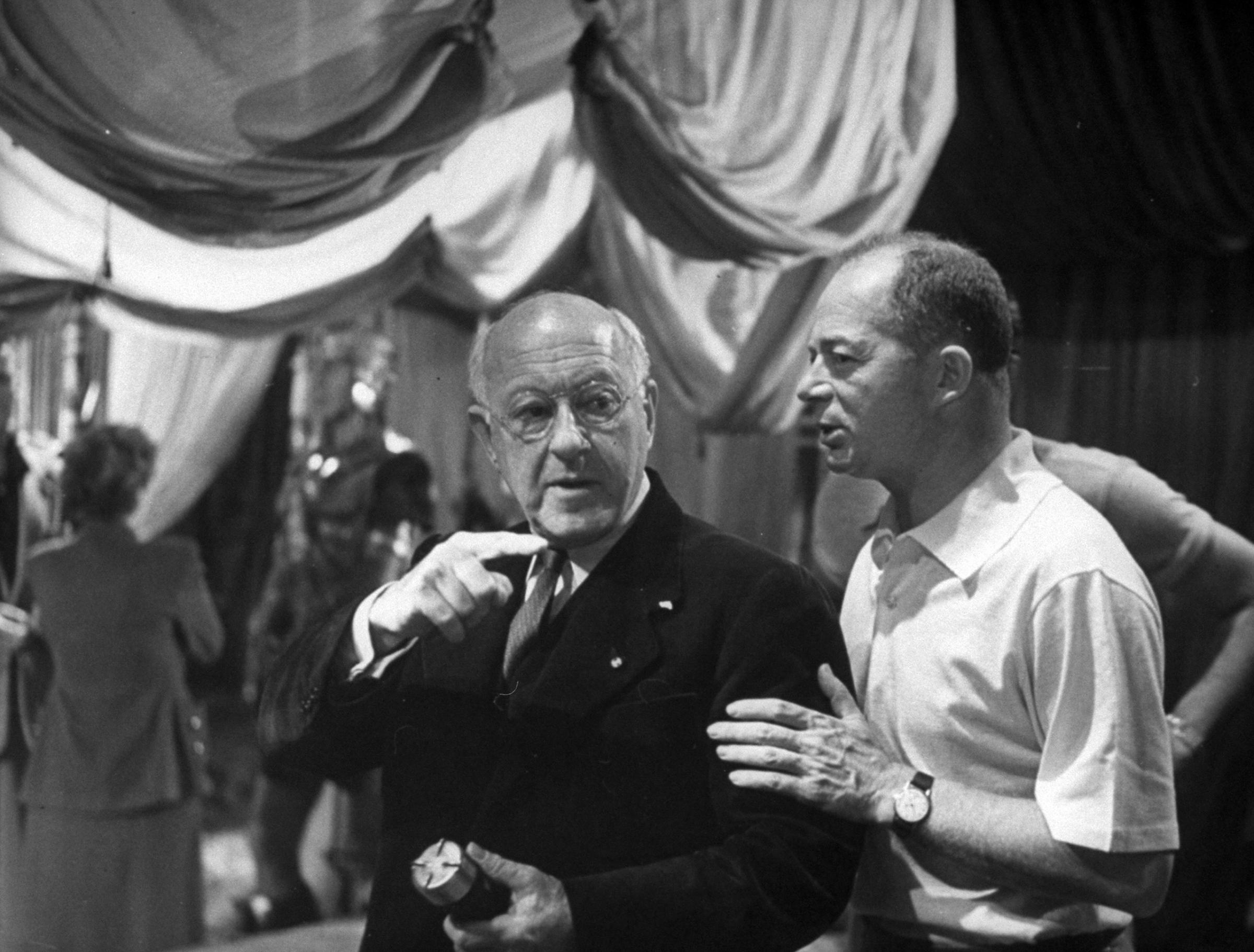 Billy Wilder and Cecil B. DeMille talking during the filming of "Sunset Blvd,' 1949.