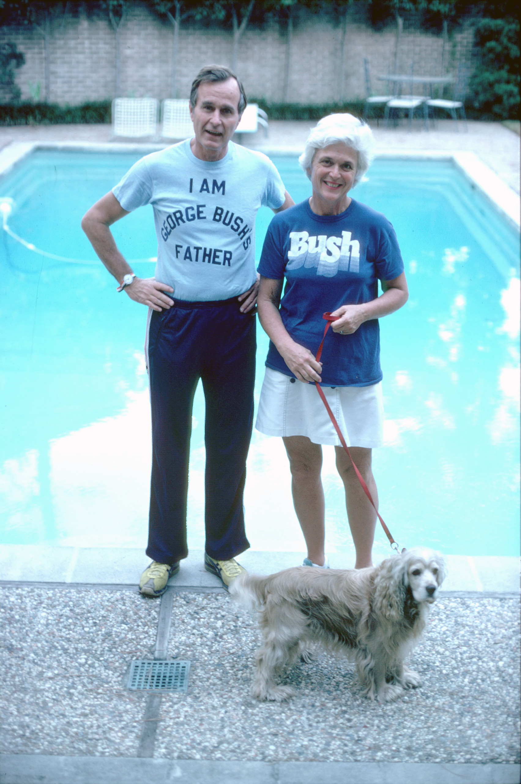 Republican Presidential candidate George H.W. Bush, wearing a t-shirt referencing his son George W. Bush, stands with his wife Barbara in Nov. 1978 in Texas.