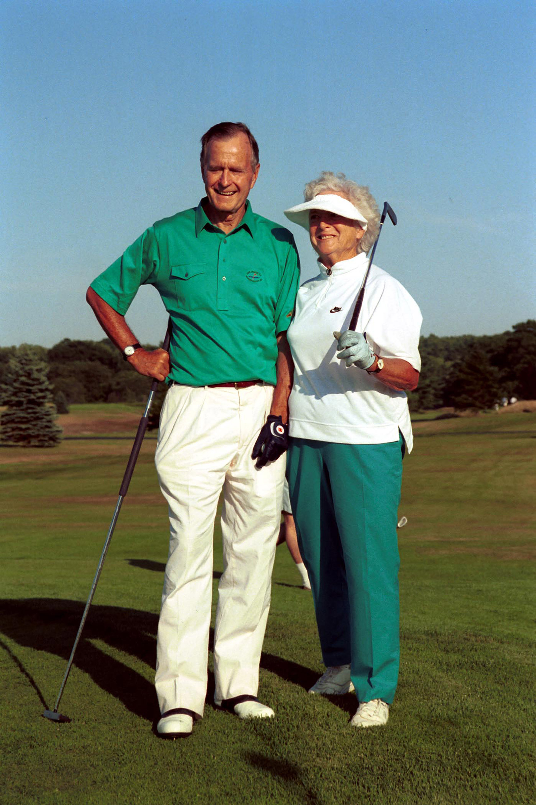 President and Mrs. Bush play golf on Aug. 7, 1991.