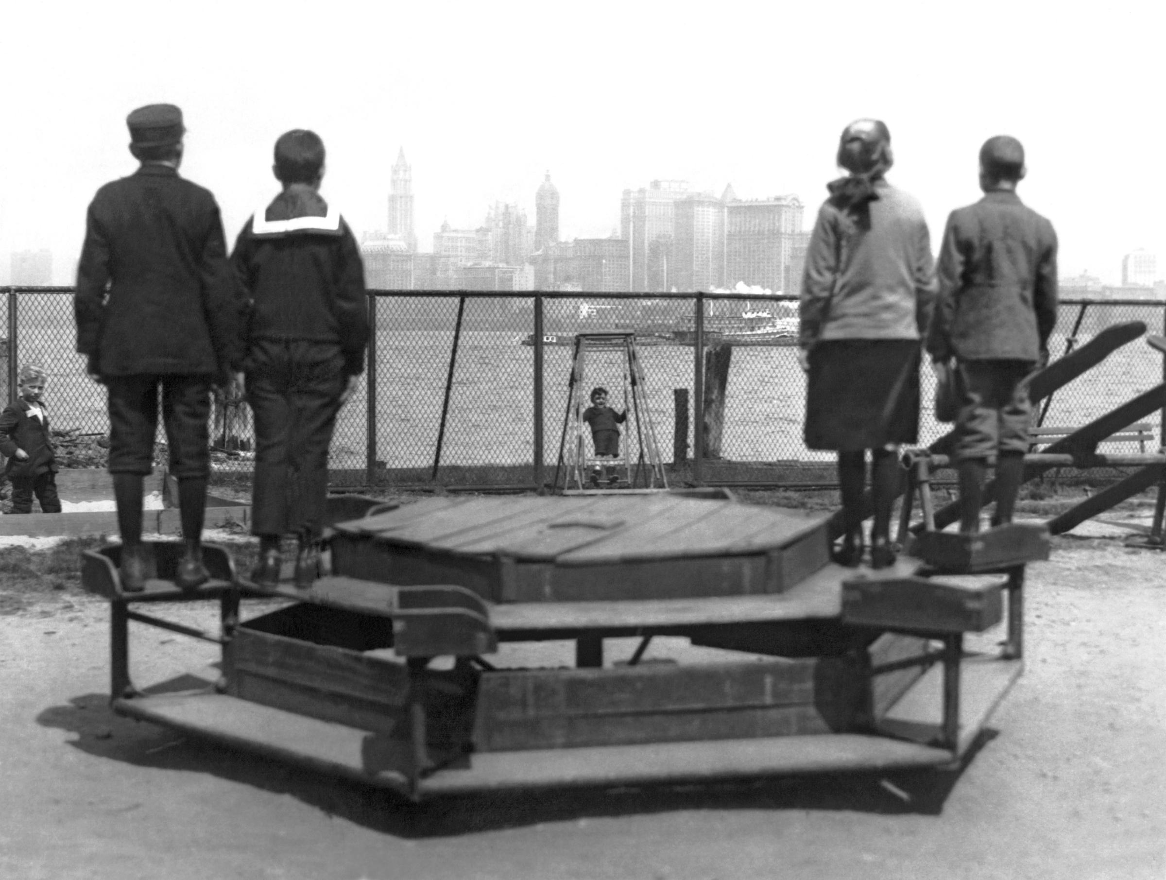 Immigrants representing four countries, Poland, Norway, Germany, and Russia, looking from Ellis Island towards New York City, circa 1913.