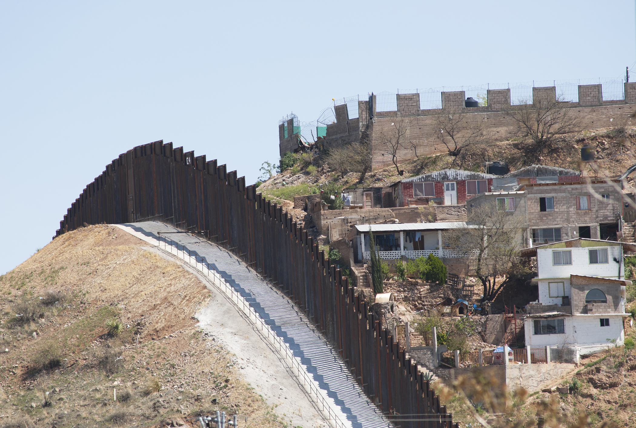 The steel beam border fence overlooks Nogales, Mexico. (Getty Images)