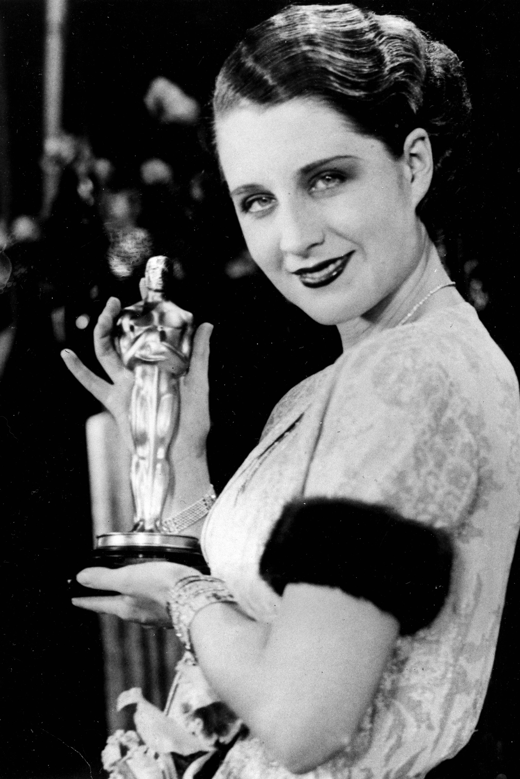 Norma Shearer poses with her Oscar at the Academy Awards banquet in 1930.