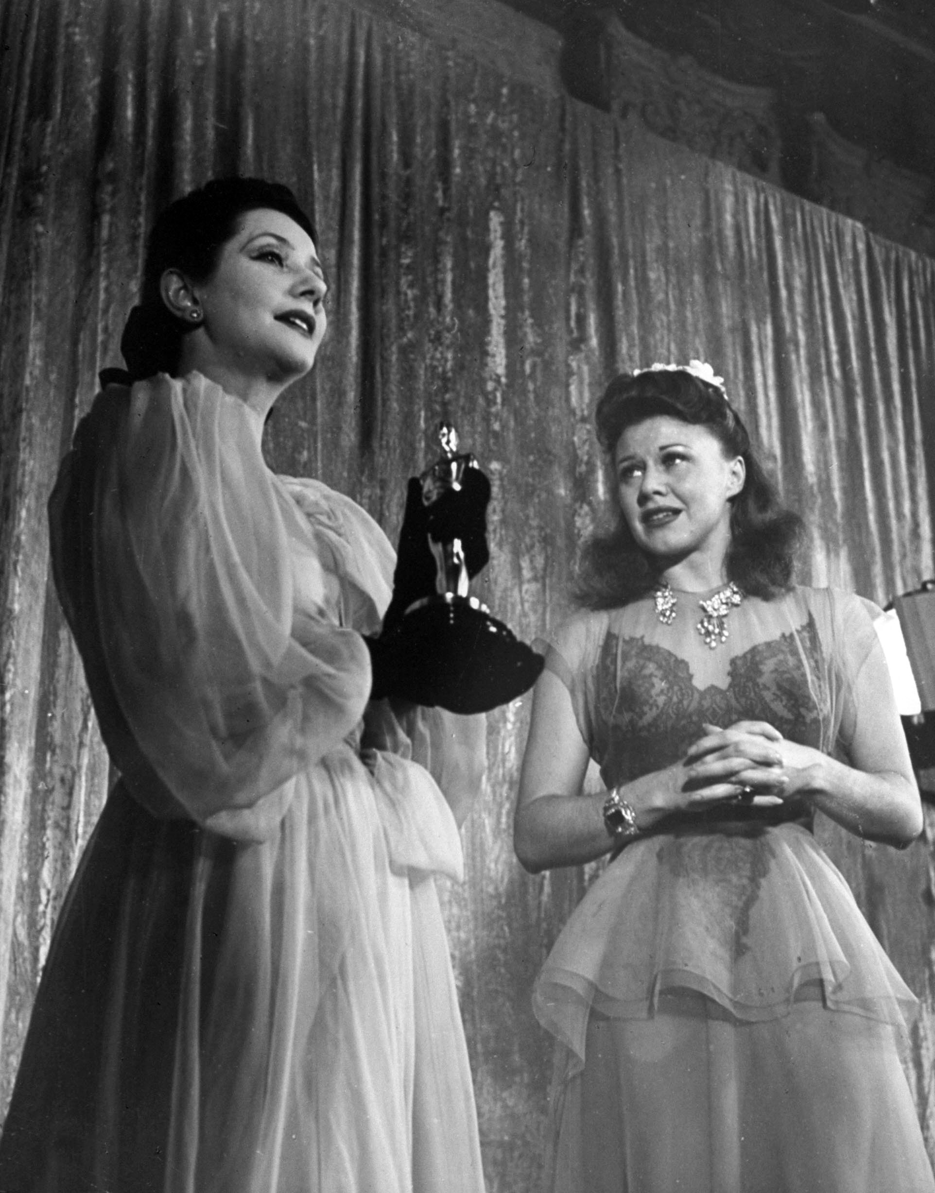 Ginger Rogers receiving an Oscar at Academy Awards presentation, 1941.