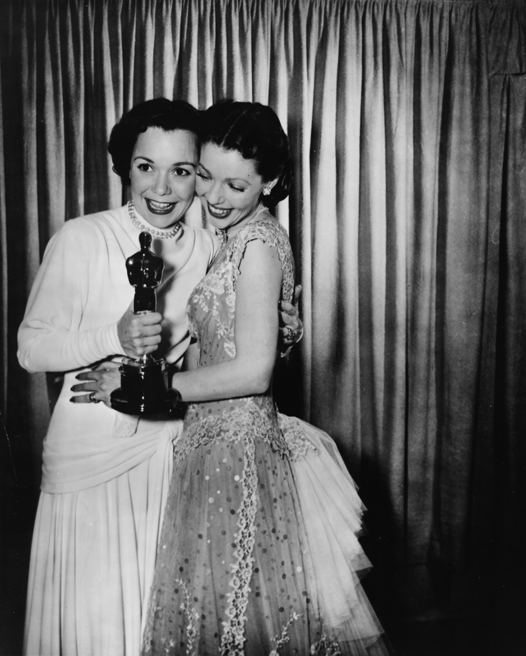 Loretta Young congratulating Jane Wyman at the Academy Awards, 1949.