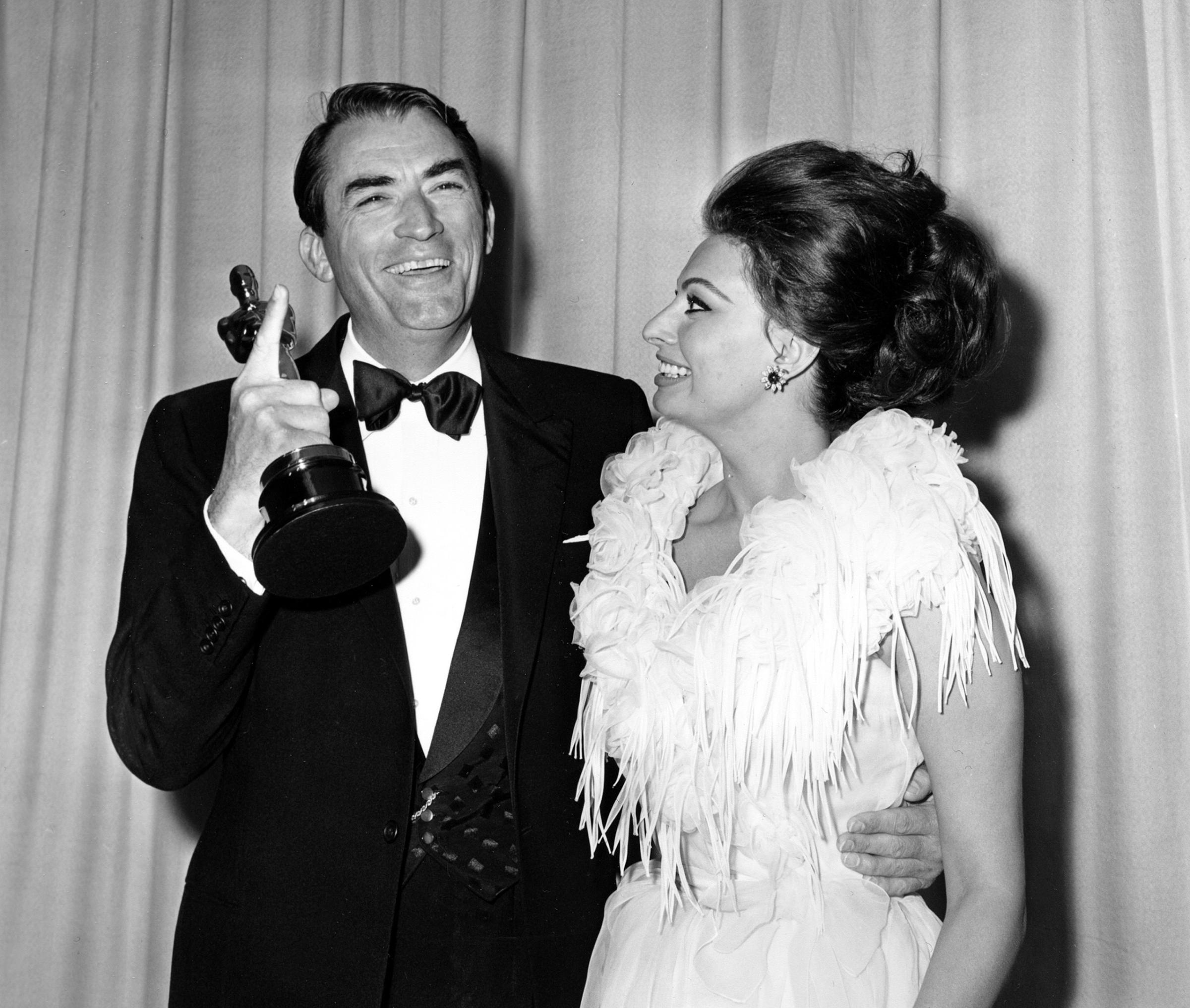 Gregory Peck with Sophia Loren at the Academy Awards, 1963.