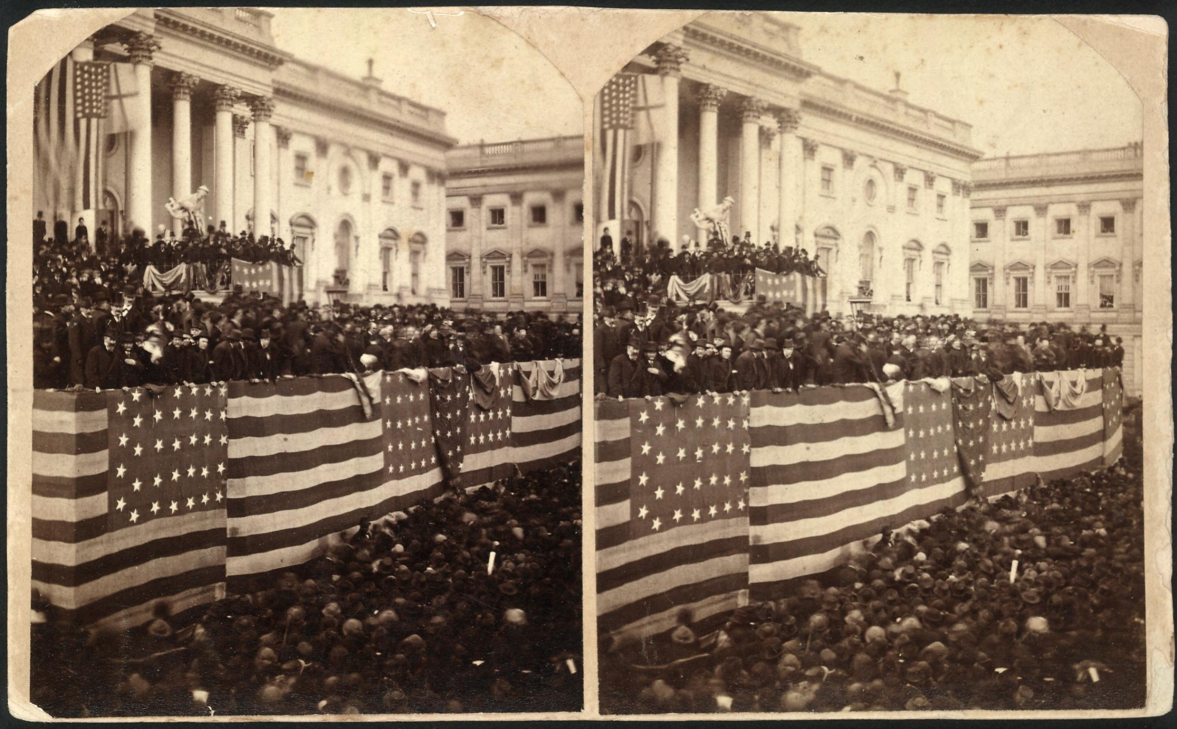 Chief Justice Morrison R. Waite administering the oath of office to Rutherford B. Hayes on a flag-draped inaugural stand on the east portico of the U.S. Capitol, 1877.
