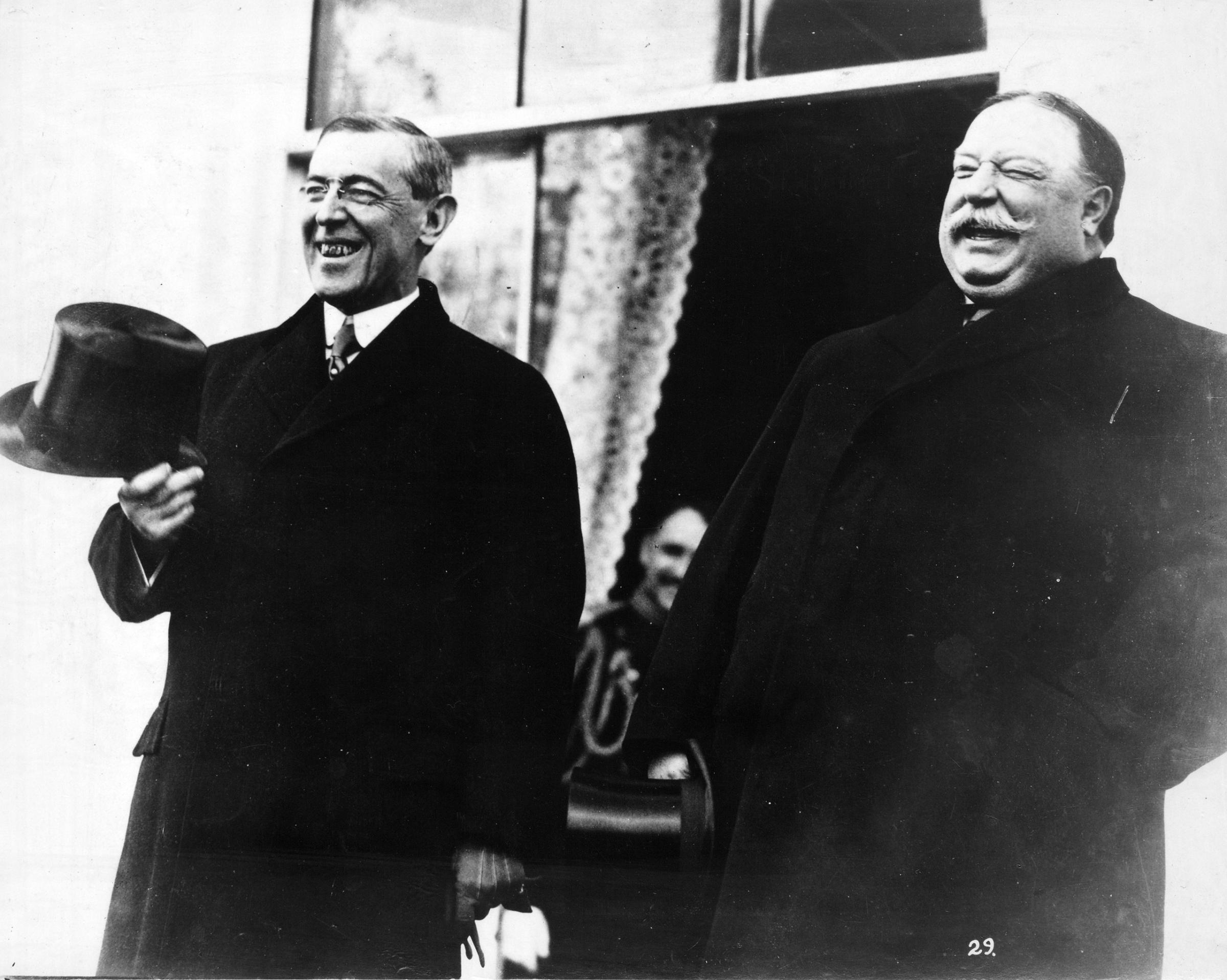 President-elect Woodrow Wilson and President Taft, standing side by side, laughing, at the White House, prior to Wilson's inauguration ceremonies, March 4, 1913.