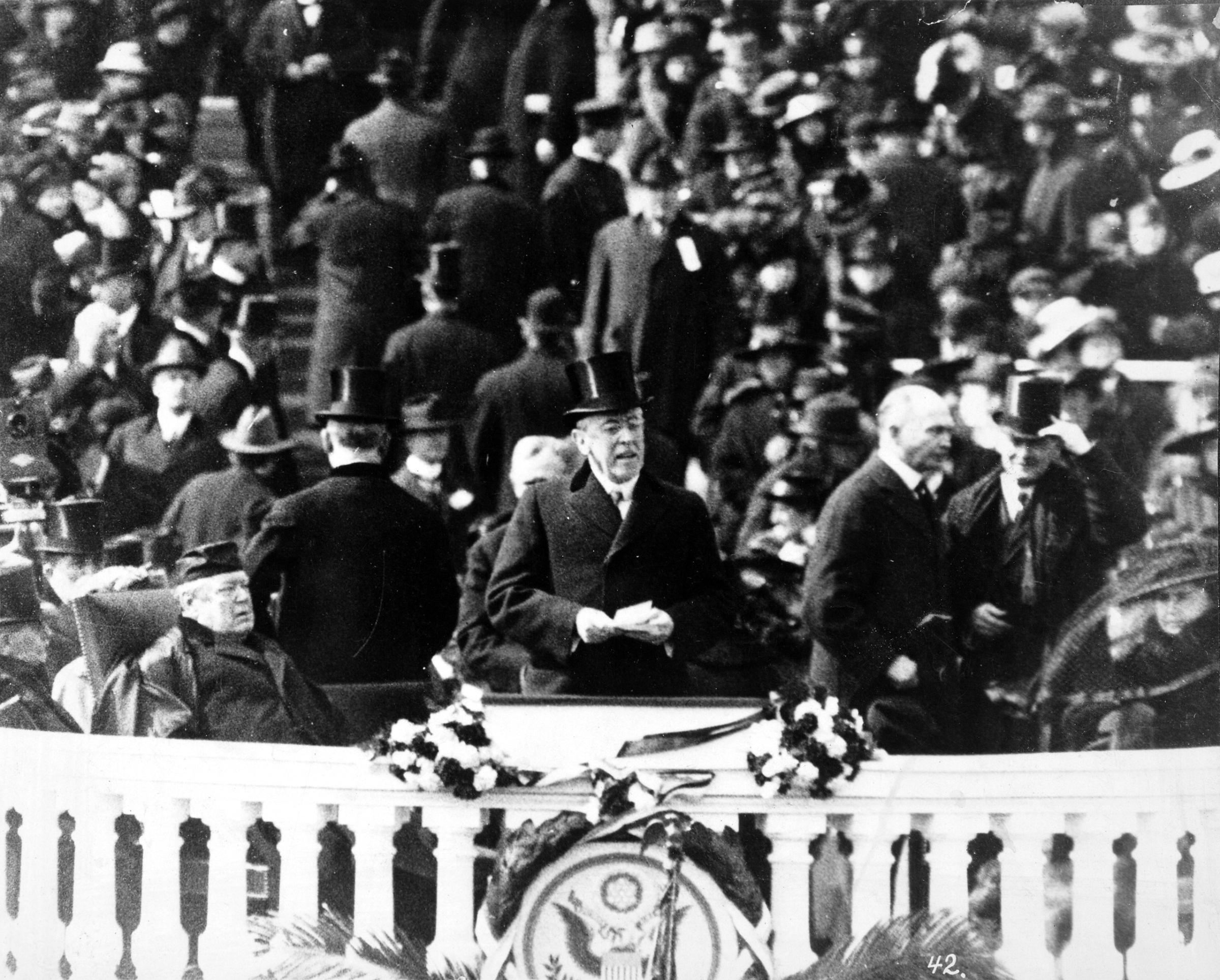 President Woodrow Wilson, with top hat and speech in hand, delivering his inaugural address, March 5, 1917.