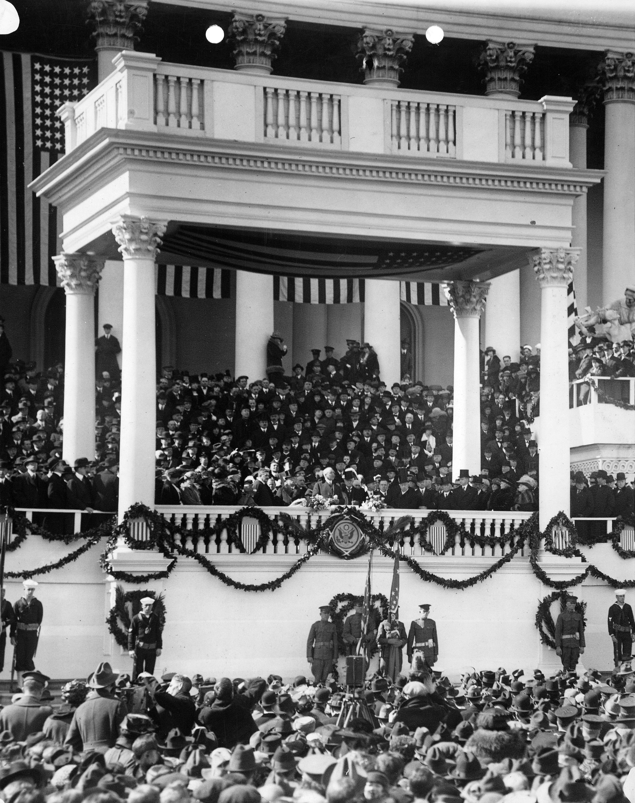 Warren G. Harding delivering his inaugural address on east portico of U.S. Capitol, March 4, 1921.