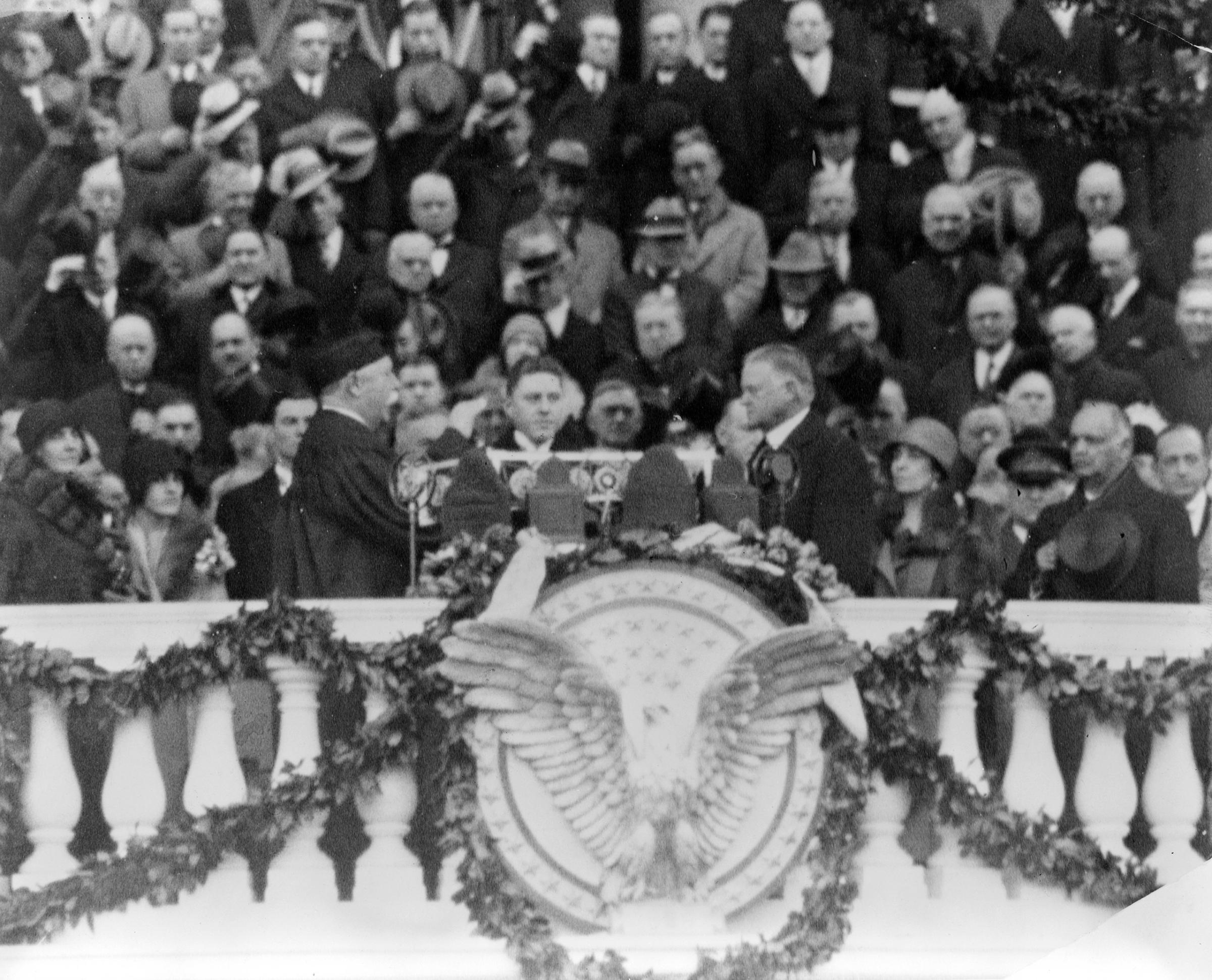 Chief Justice William H. Taft administering the oath of office to Herbert Hoover on the east portico of the U.S. Capitol, March 4, 1929.