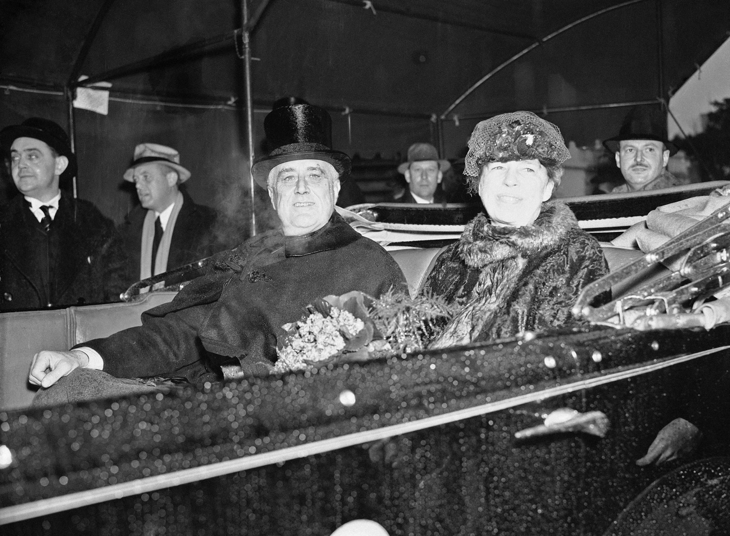 President Franklin D. Roosevelt and first lady Eleanor Roosevelt are seen up Pennsylvania Avenue during the inaugural parade in Washington, Jan. 4, 1937.