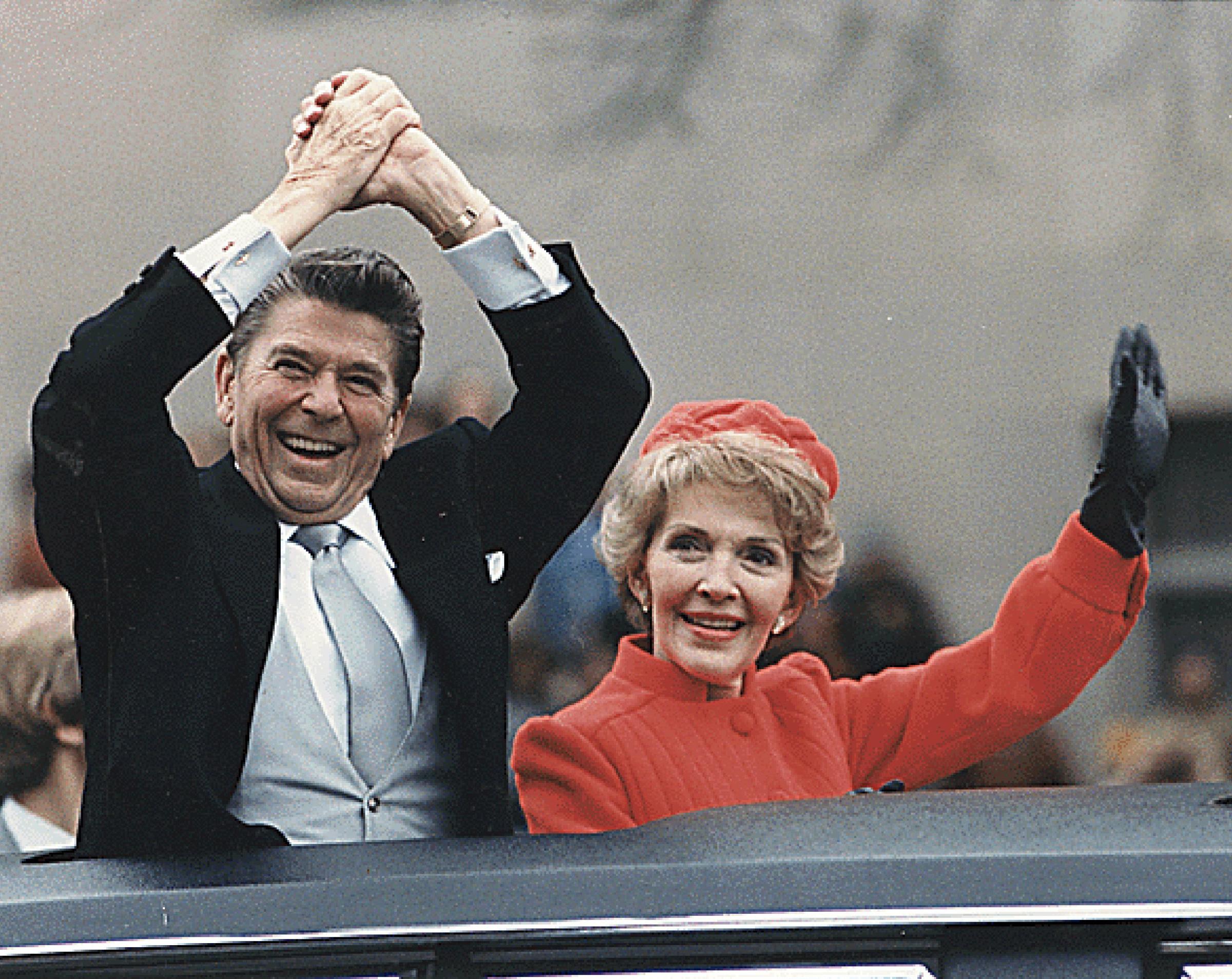 President Ronald Reagan and First Lady Nancy Reagan wave to well-wishers during the Inaugural Parade in Washington, DC on January 20, 1981.