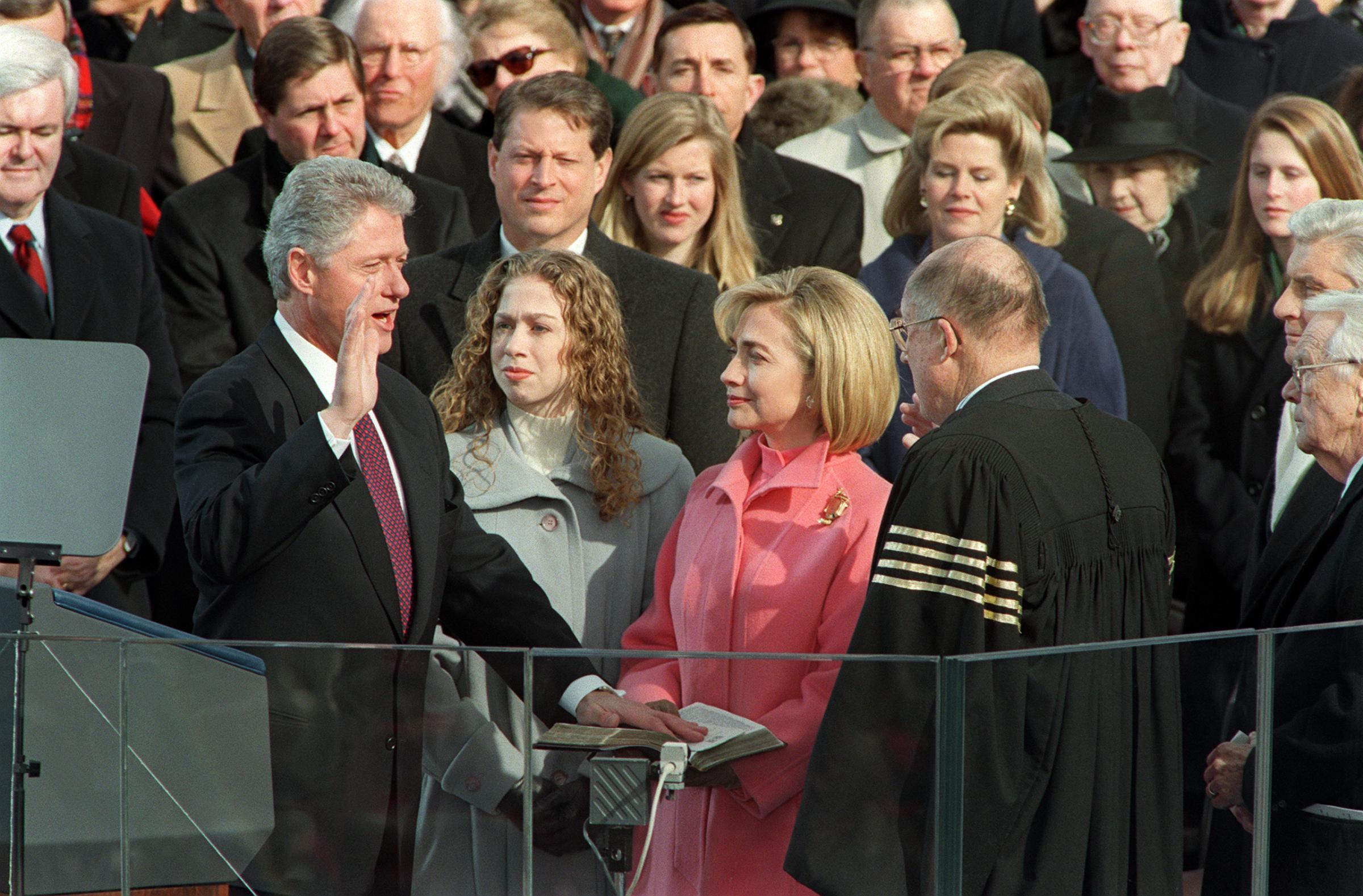 President Bill Clinton is sworn in Jan. 20, 1997 on Capitol Hill in Washington, D.C., for his second term as president of the United States by US Supreme Court Chief Justice William Rehnquist as First Lady Hillary Rodham Clinton and daughter Chelsea look on.