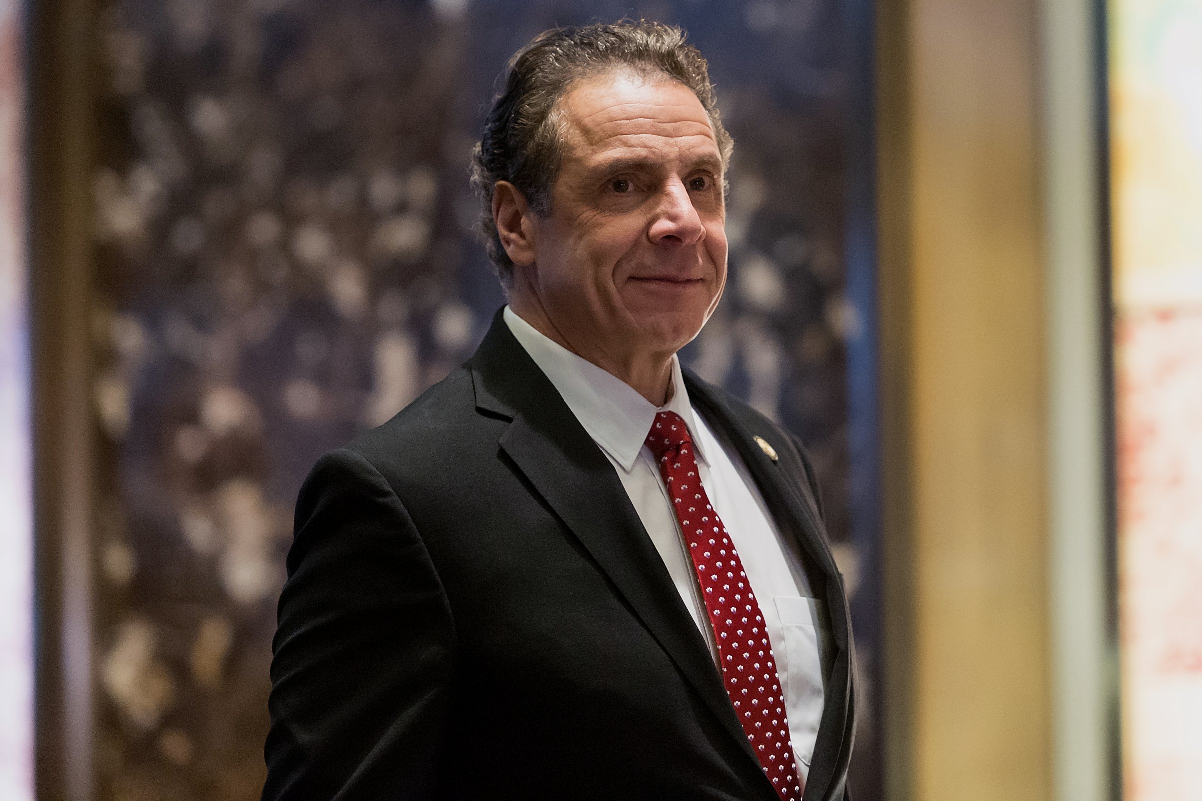 Andrew Cuomo, governor of New York, arrives in the lobby of Trump Tower in New York, on Jan. 18, 2017.