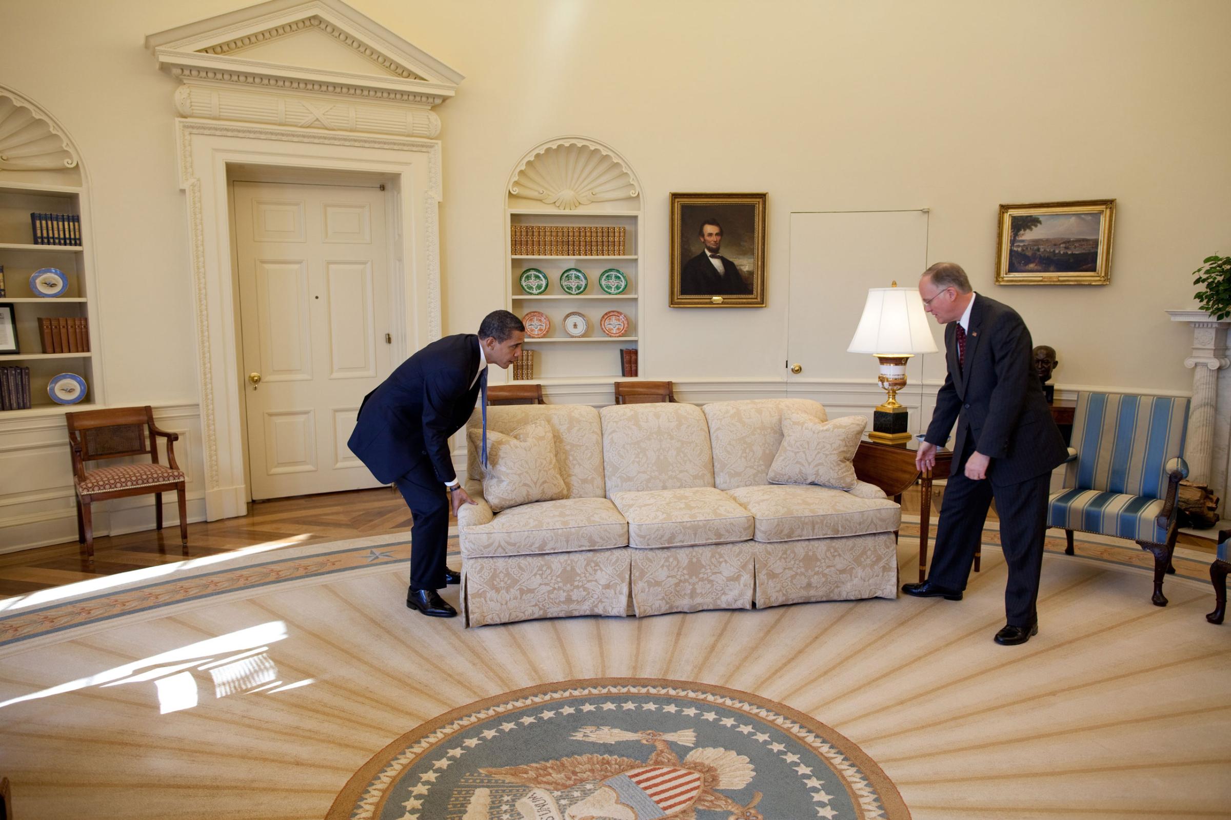 “White House valets had moved the sofas in the Oval Office to accommodate the large number of press photographers that were covering the President’s meeting with Vermont Gov. Jim Douglas. When the photo-op ended, the President said to Gov. Douglas, ‘let’s move the sofas back in place.’ Gov. Douglas didn’t quite know what to do as the President did the heavy lifting. The valets now good-naturedly cringe when they look at this picture because it was their responsibility to move the sofas back in place.”Feb. 2, 2009