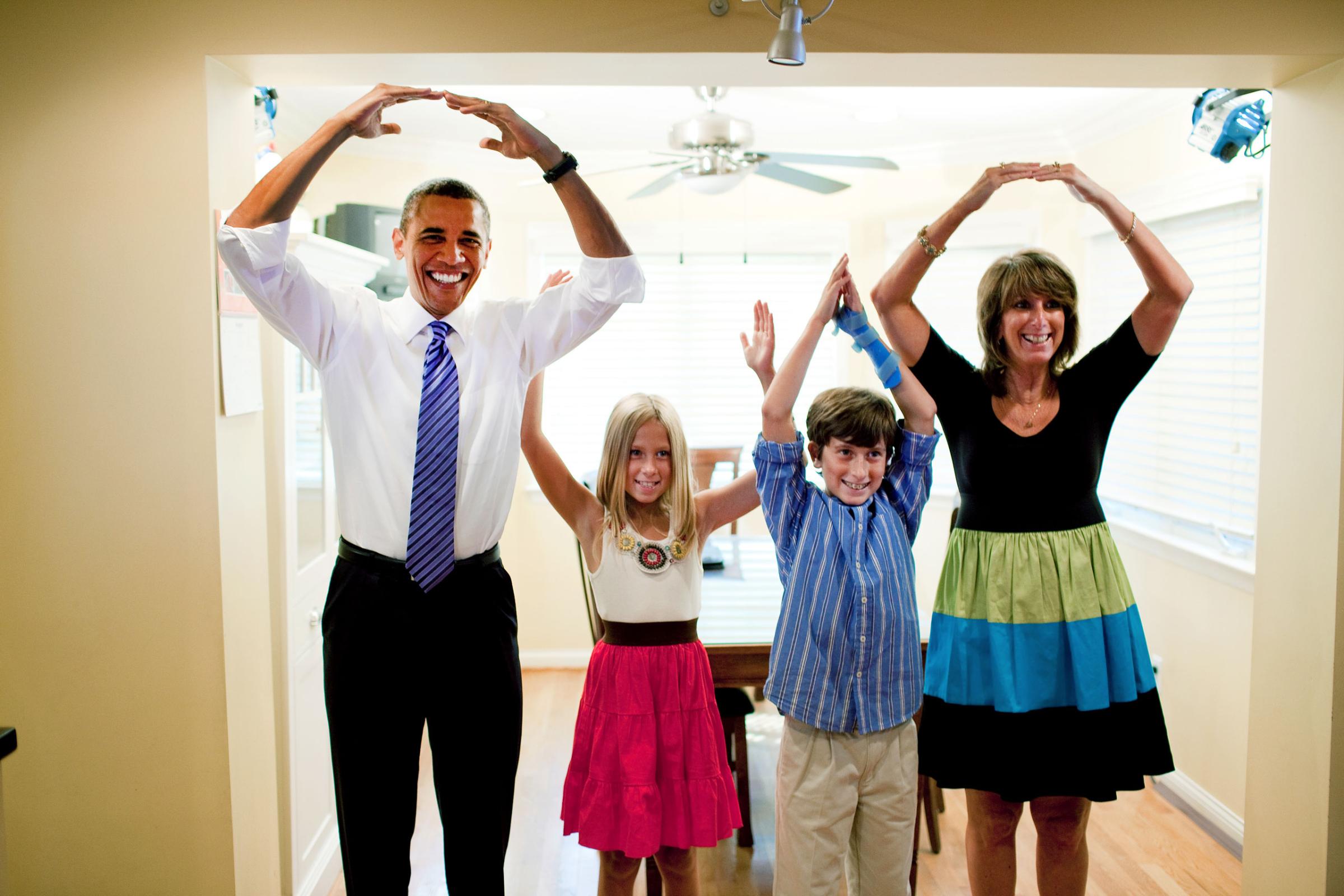 President Barack Obama helps spell out "Ohio" with the Weithman family, Rachel, 9, Josh, 11, and mom Rhonda, in their home in Columbus, Ohio, Aug. 18, 2010.