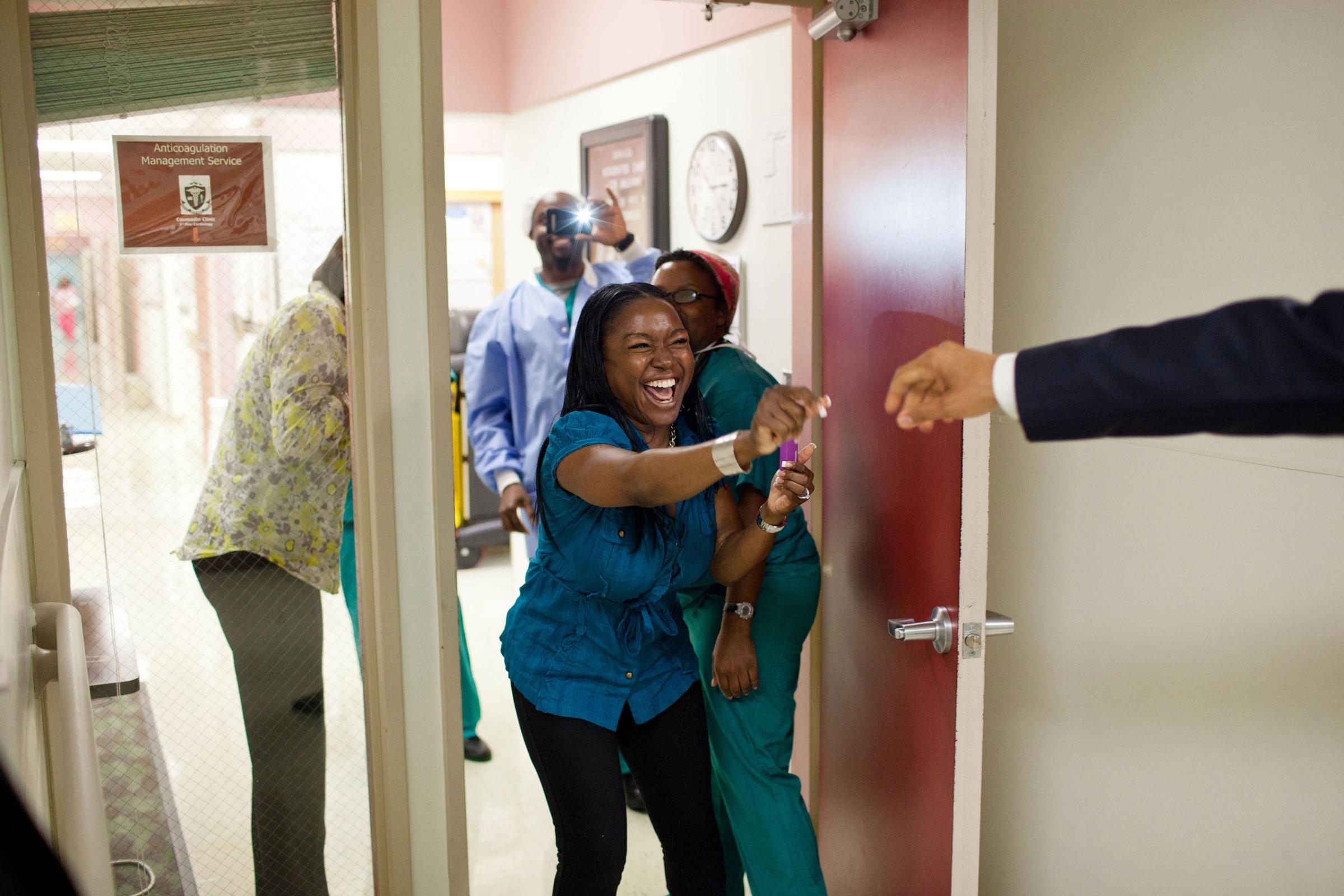 President Barack Obama greets hospital workers while visiting wounded service members at Walter Reed Army Medical Center in Washington, D.C., June 17, 2011.