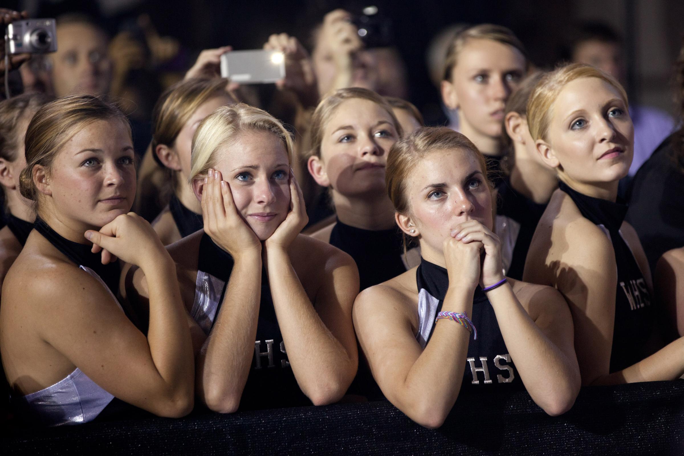 Oct. 17, 2011"A group of high school cheerleaders listen in rapt attention as the President delivered remarks on the American Jobs Act at West Wilkes High School in Millers Creek, N.C." (Official White House Photo by Pete Souza)This official White House photograph is being made available only for publication by news organizations and/or for personal use printing by the subject(s) of the photograph. The photograph may not be manipulated in any way and may not be used in commercial or political materials, advertisements, emails, products, promotions that in any way suggests approval or endorsement of the President, the First Family, or the White House.