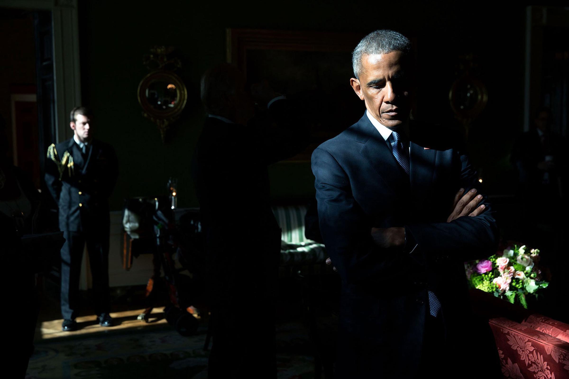 “With sunlight streaming through a window in the Green Room, President Obama listens to his introduction by Mark Barden, whose 7-year-old son Daniel was killed during the 2012 shooting at Sandy Hook Elementary School in Newtown, Conn. Later, as he made remarks in the East Room, he began to cry as he recalled the day of the shootings; he called it the worst day of his Presidency, Jan. 5, 2016.”