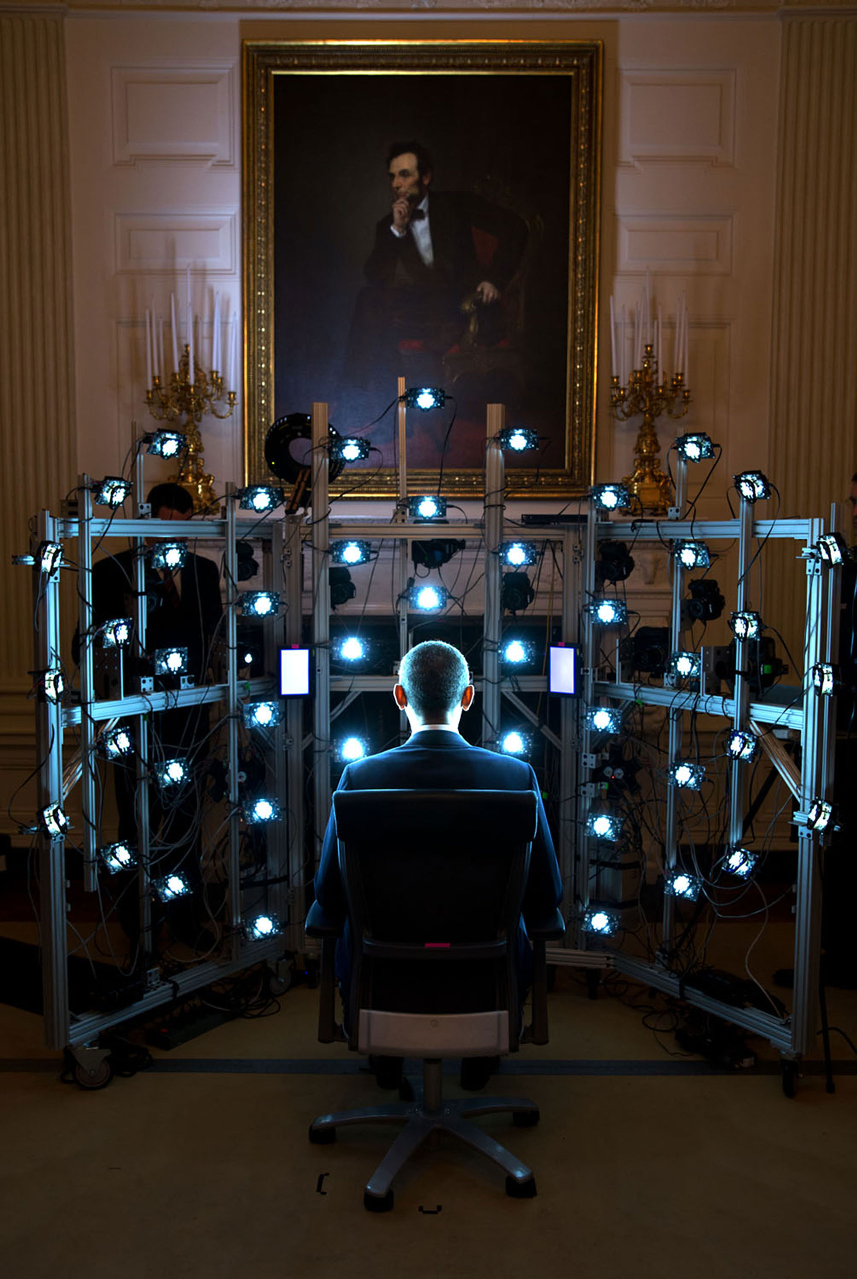 The President sits for a 3D portrait being produced by the Smithsonian Institution. There were so many cameras and strobe lights flashing but the end result was kind of cool,  June 9, 2014.