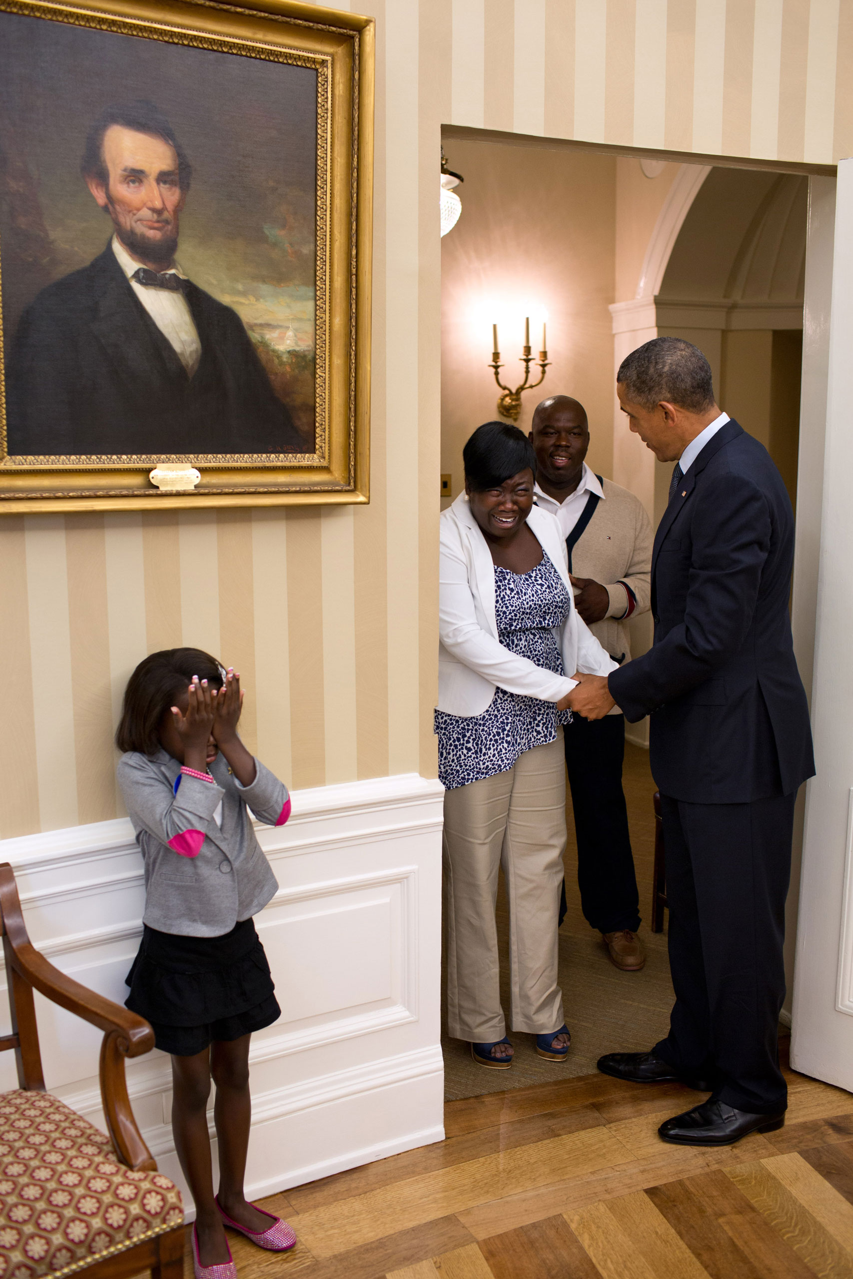Eight-year old Make-A-Wish child Janiya Penny reacts after meeting President Barack Obama as he welcomes her family to the Oval Office, Aug. 8, 2012.